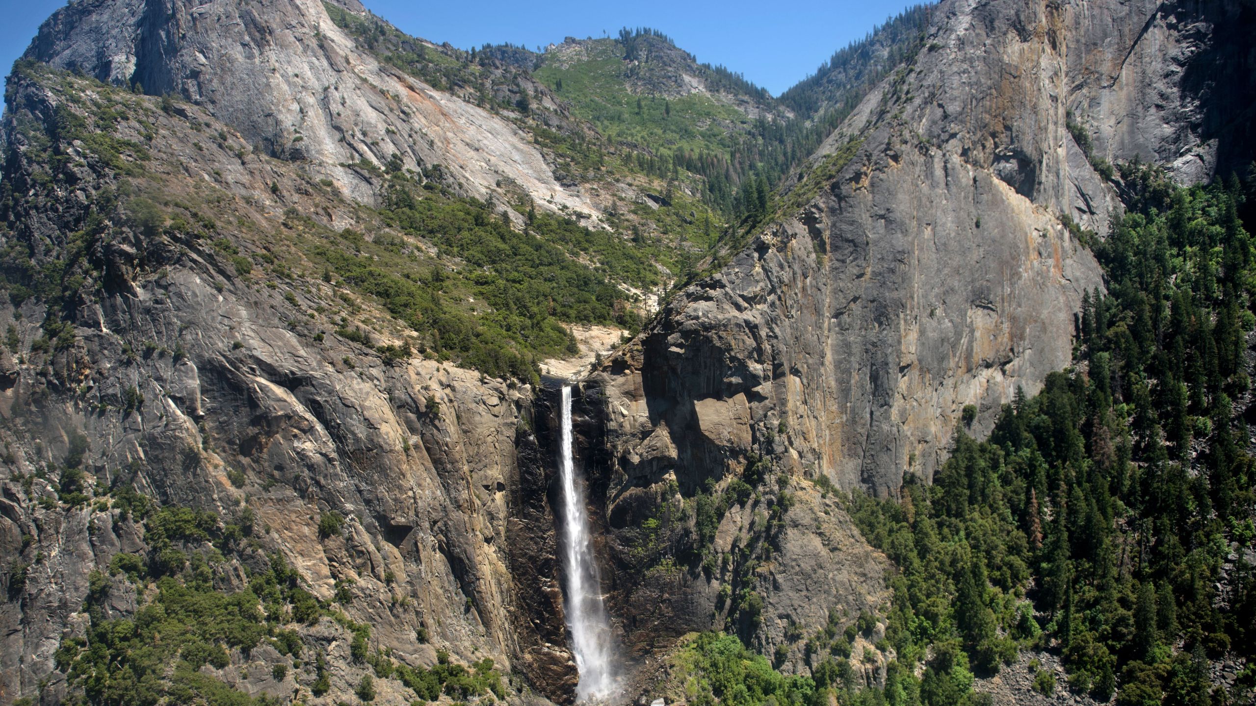 A helicopter view of a waterfall in Yosemite National Park June 19, 2016, in Yosemite Valley. (Credit: BRENDAN SMIALOWSKI/AFP/Getty Images)