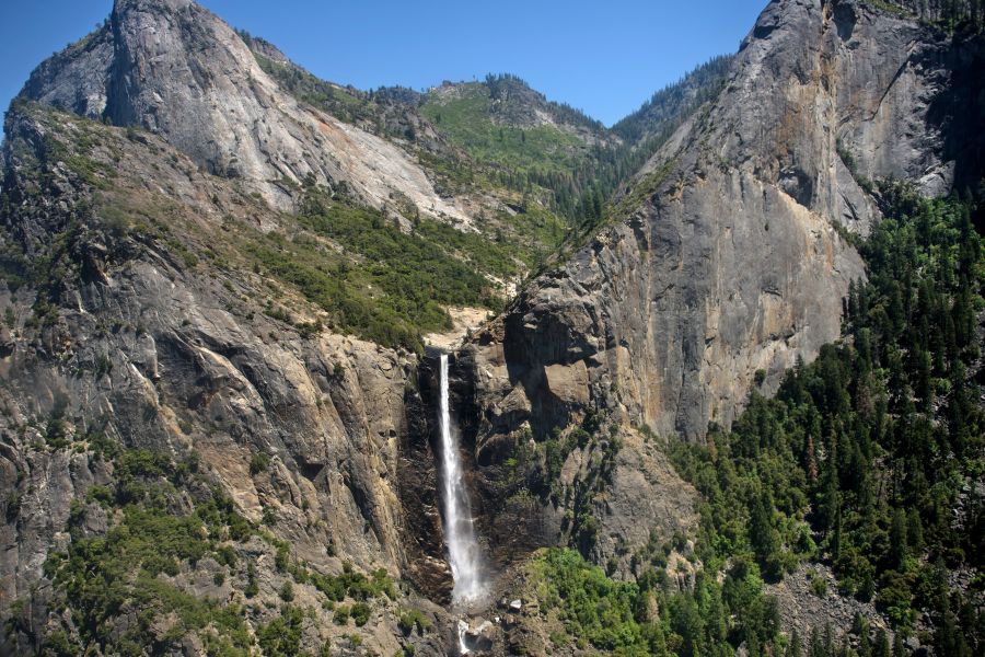 A helicopter view of a waterfall in Yosemite National Park June 19, 2016, in Yosemite Valley. (Credit: BRENDAN SMIALOWSKI/AFP/Getty Images)