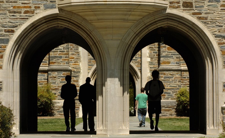 Students pass under the arches at Duke University Tuesday, April 11, 2006 in Durham, North Carolina. (Credit: Sara D. Davis/Getty Images)