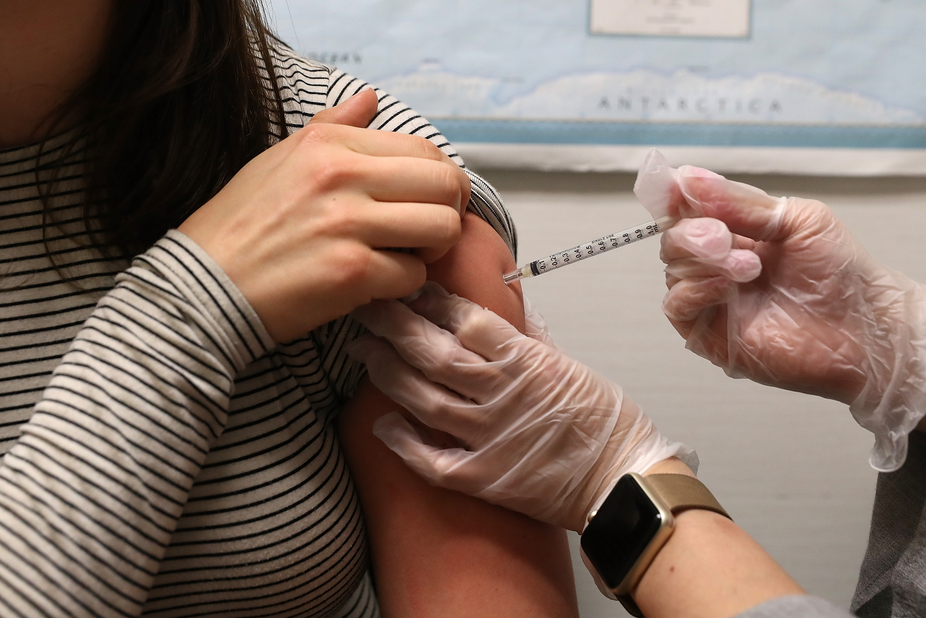 A woman receives a flu shot at a Walgreens pharmacy on January 22, 2018 in San Francisco. (Credit: Justin Sullivan/Getty Images)