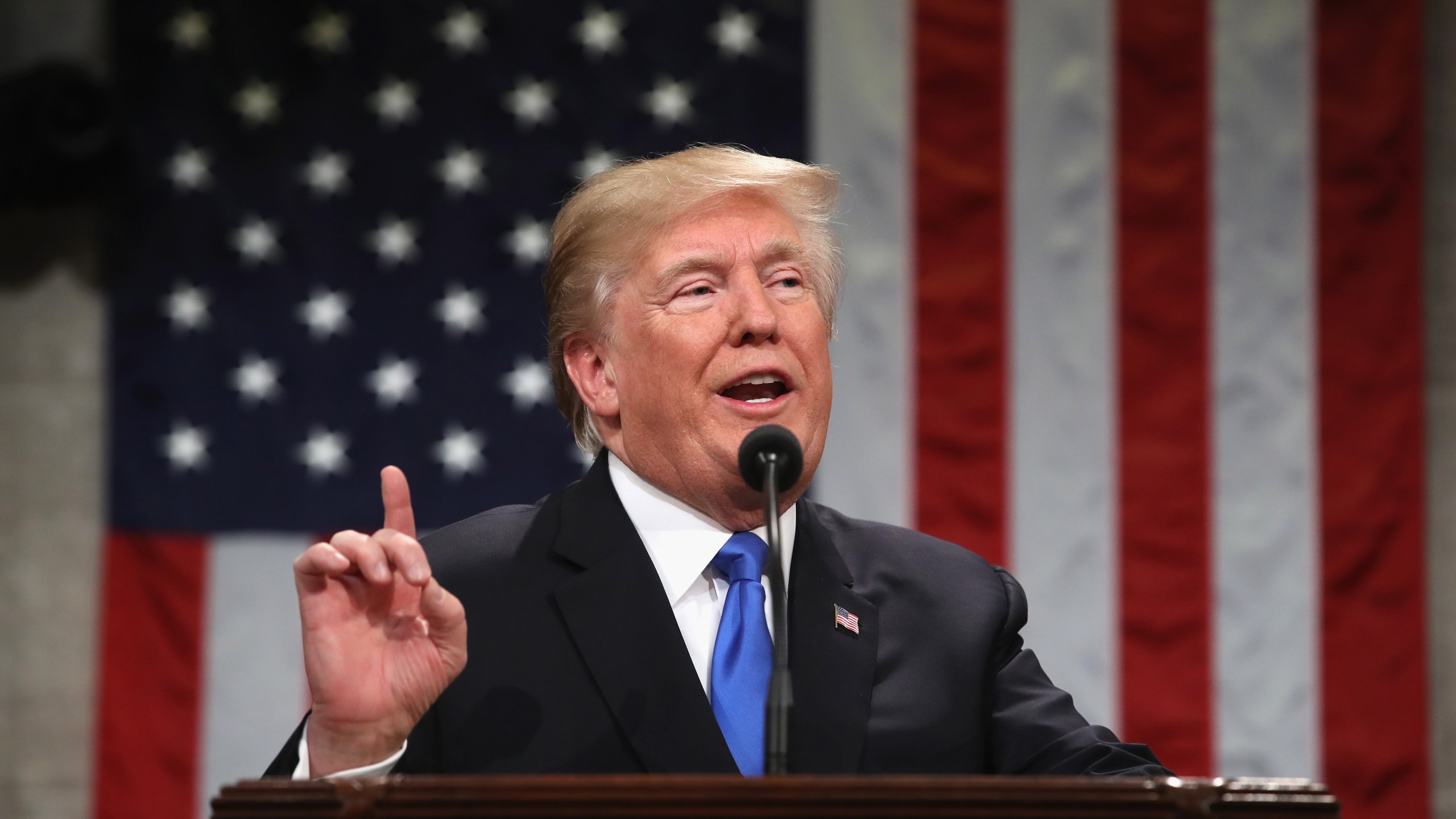 US President Donald Trump gestures during the State of the Union address in the chamber of the US House of Representatives in Washington, DC, on January 30, 2018. (Credit: WIN MCNAMEE/AFP/Getty Images)