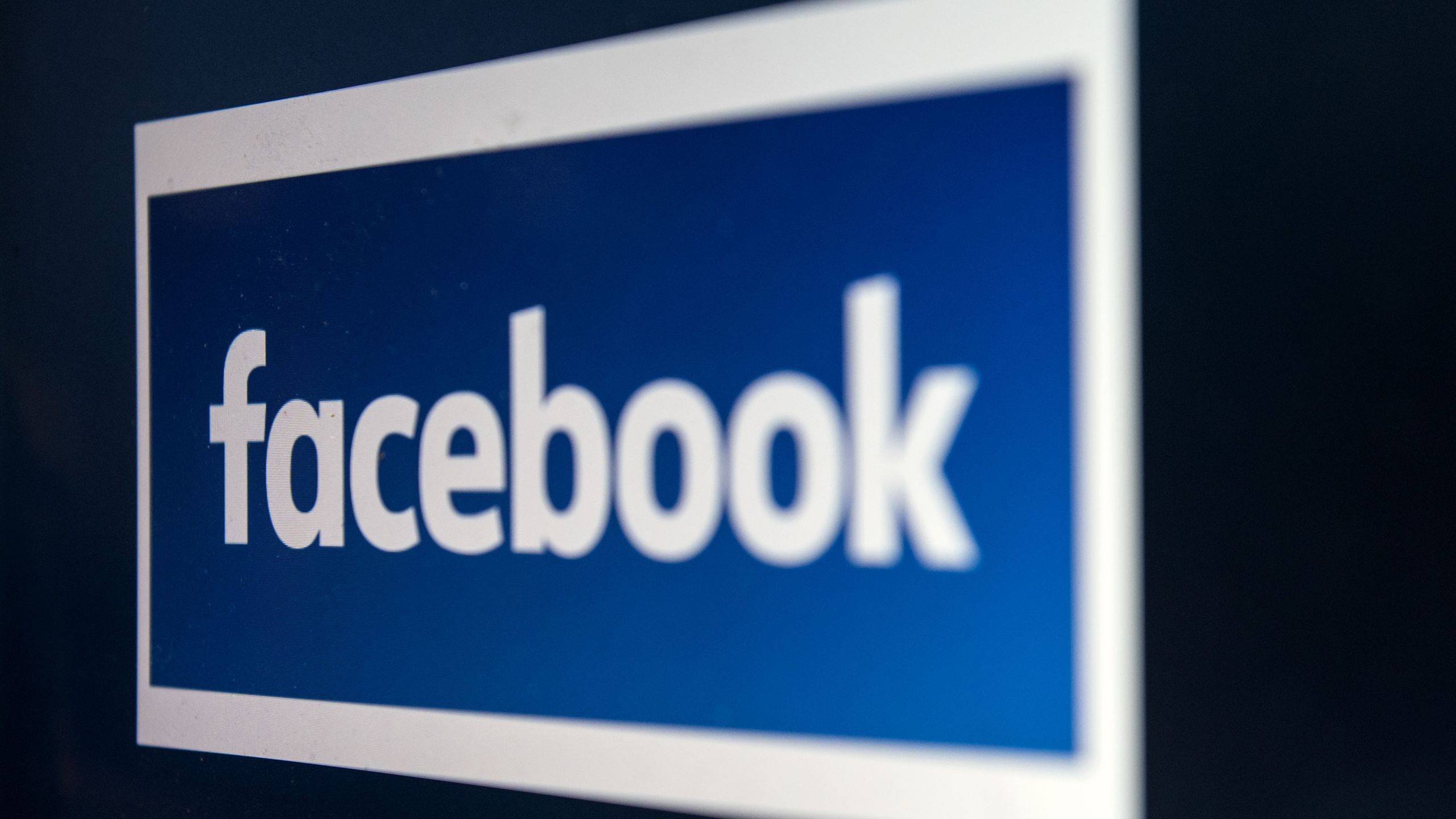 A computer screen displays the logo of the social networking site Facebook, taken in Manchester, England on March 22, 2018. (Credit: OLI SCARFF/AFP/Getty Images)