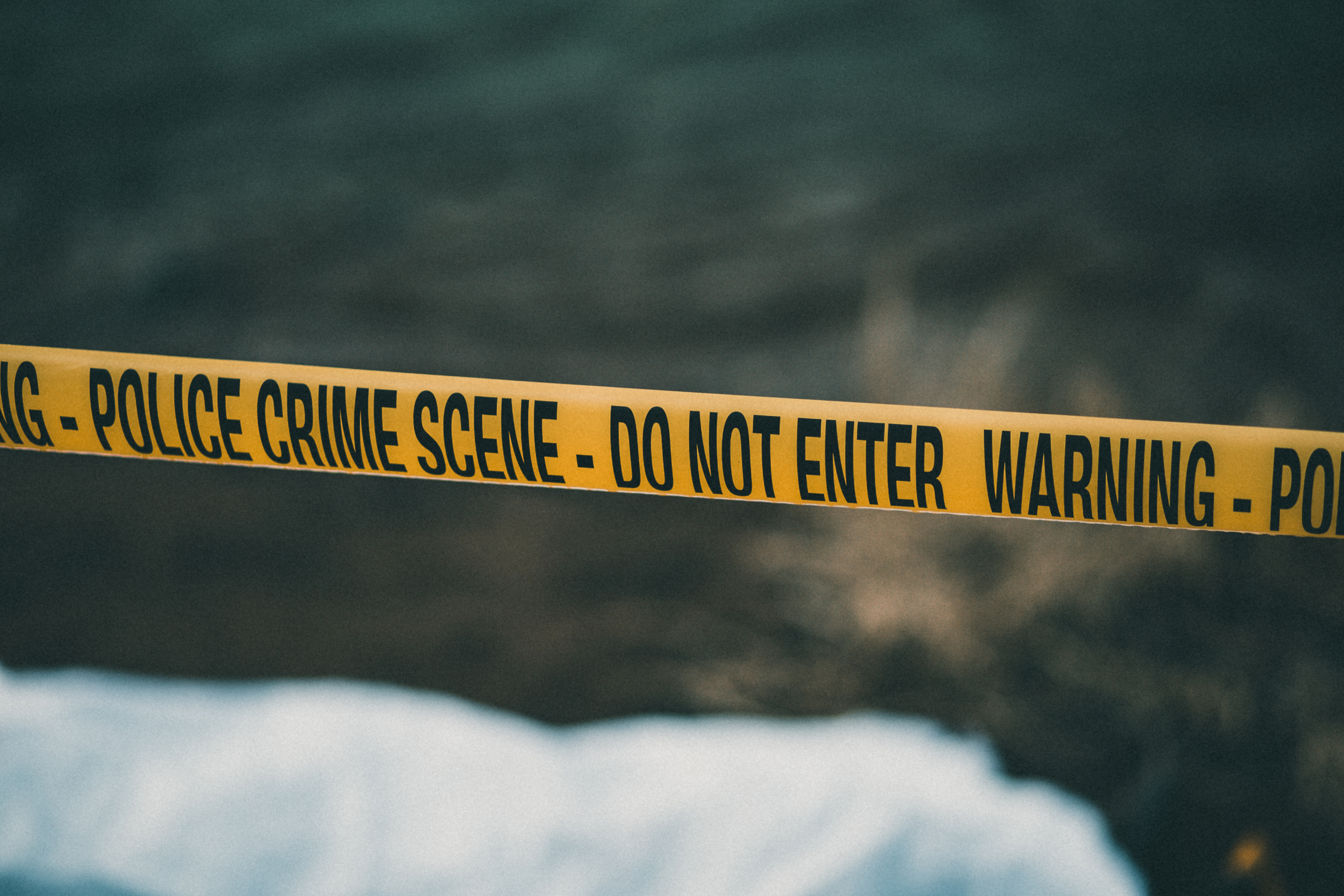 A crime scene with yellow police tape is shown in a file photo. (Credit: E+ via Getty Images)