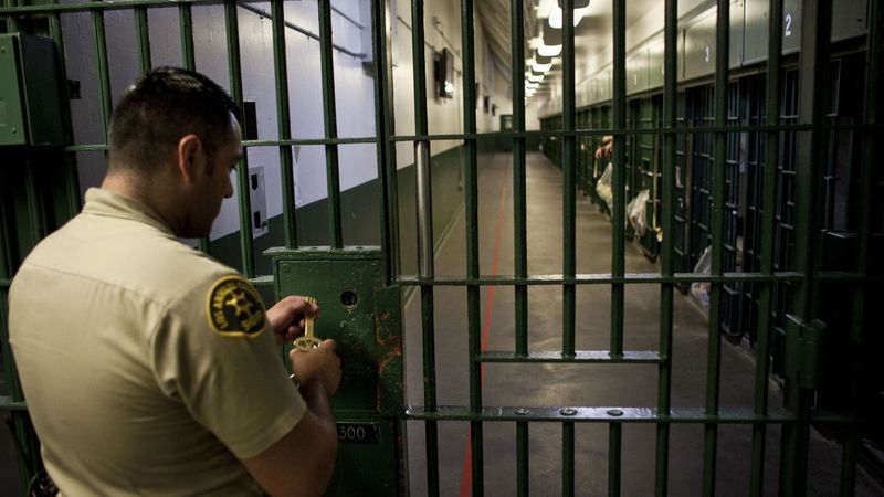 A Los Angeles County sheriff's deputy prepares to unlock a security door at the L.A. County Men's Central Jail in this undated photo. (Credit: Jay L. Clendenin / Los Angeles Times)