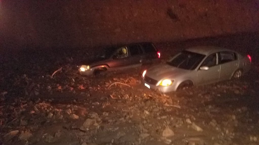 Two cars became stuck in a mudslide along Pacific Coast Highway in Malibu on Jan. 5, 2019. (Credit: Caltrans)