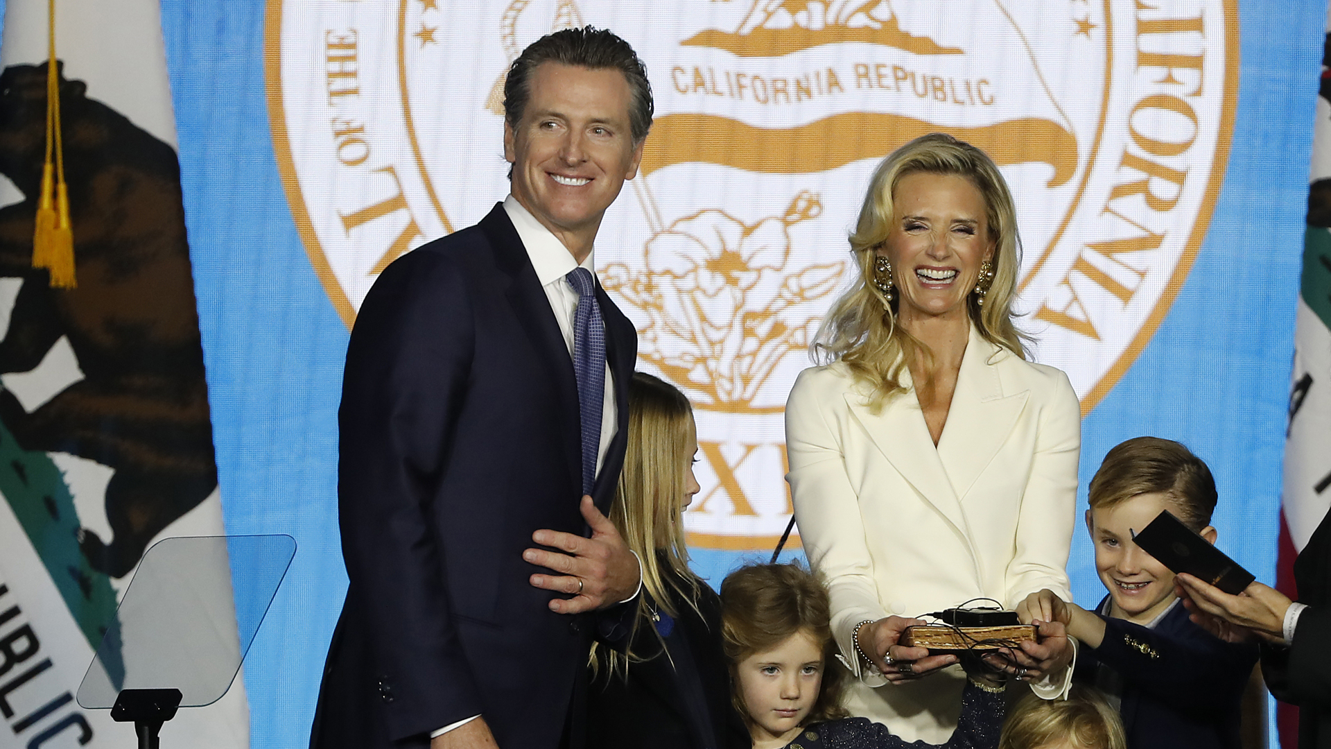 Gavin Newsom is sworn in as governor of California by California Chief Justice Tani Gorre Cantil-Sakauye as Newsom's wife, Jennifer Siebel Newsom, watches on Jan. 7, 2019, in Sacramento. (Credit: Stephen Lam/Getty Images)