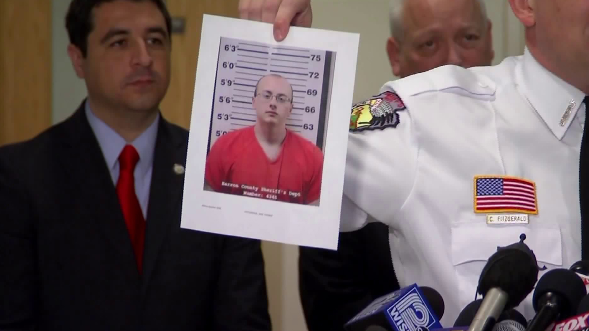 Jake Thomas Patterson is shown in a photo held up by Barron County Sheriff Chris Fitzgerald at a news conference on Jan. 11, 2019. (Credit: CNN)