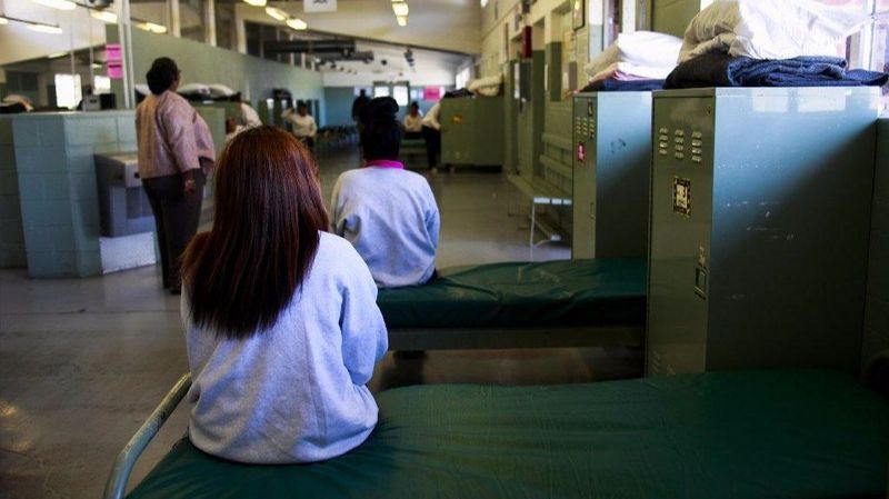 An undated photo shows girls detained at Camp Kenyon Scudder sitting in their shared dorm space at the Santa Clarita juvenile probation facility. (Credit: Los Angeles Times)