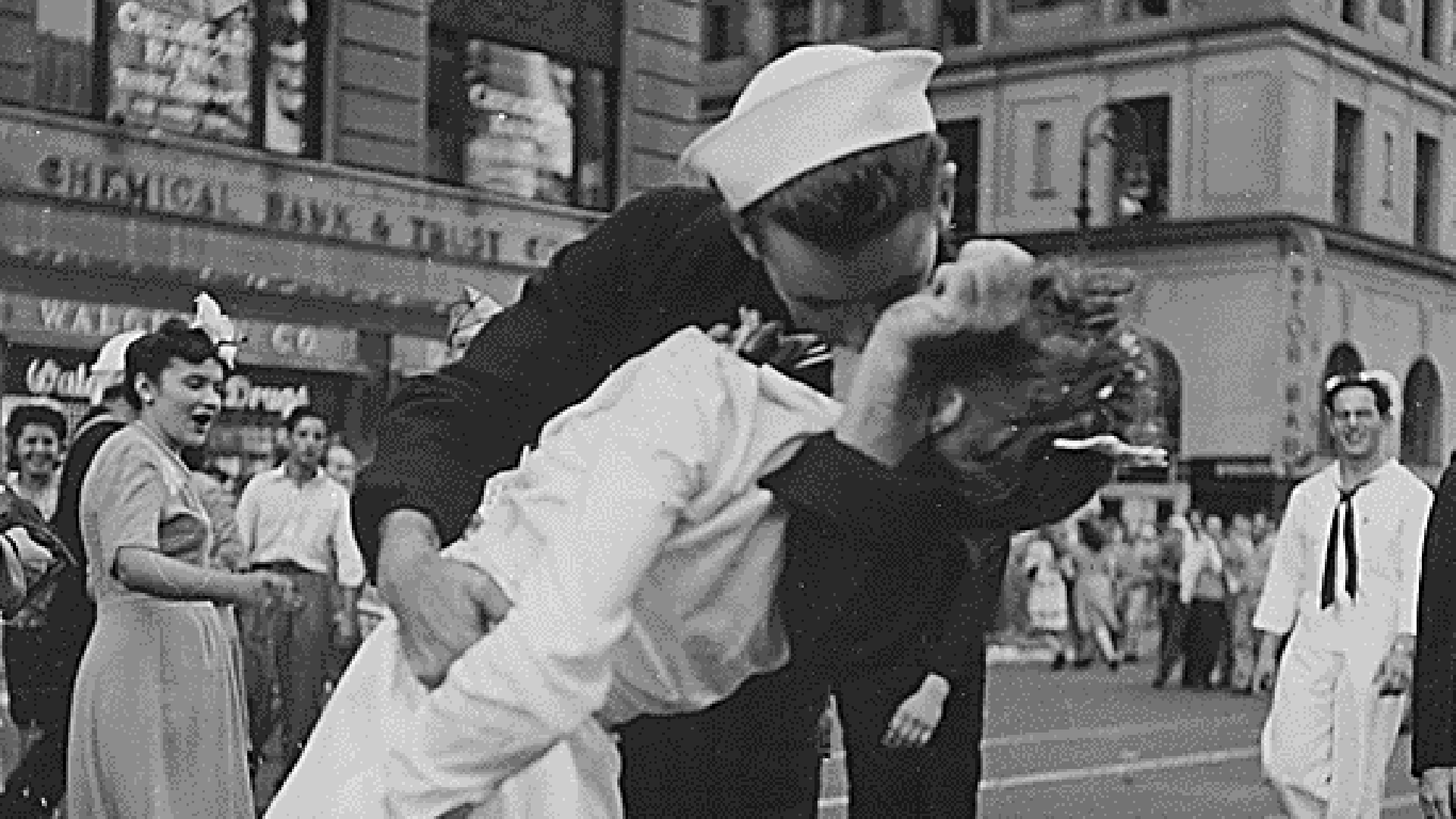 A U.S. Navy sailor is seen kissing a woman in Times Square, New York after the announcement of Japan's surrender on August 14, 1945. (Credit: Victor Jorgenson via the National Archives)