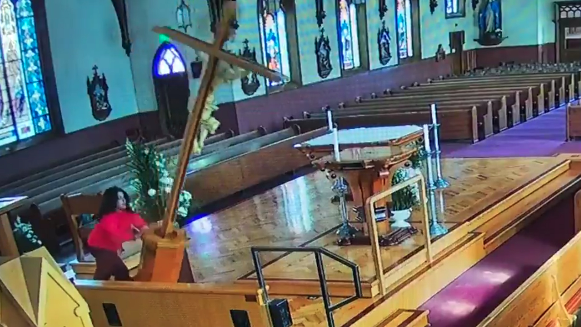 A woman is seen vandalizing a church in Watsonville, in this still from footage released by local police on Feb. 7, 2019.