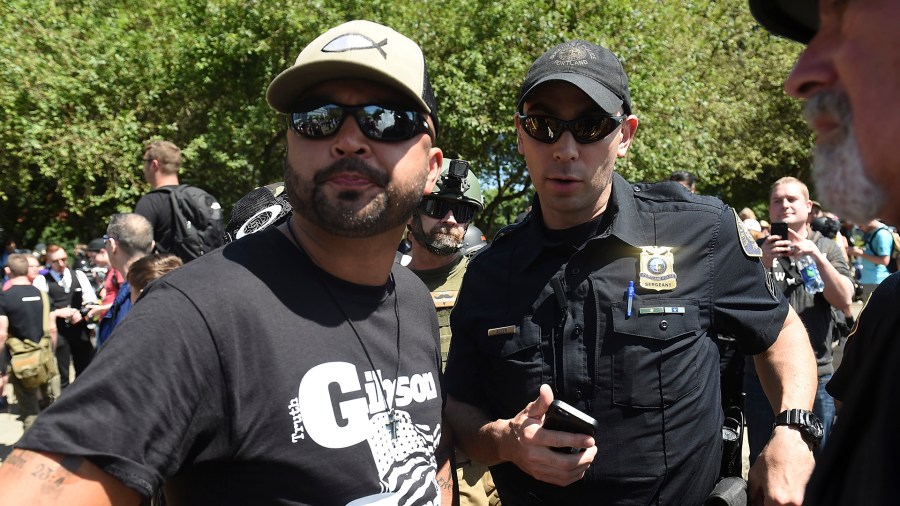 Patriot Prayer leader Joey Gibson speaks with Portland Police during the Alt Right Rally at Tom McCall Waterfront Park on August 4, 2018 in Portland, Oregon. (Credit: Steve Dykes/Getty Images)