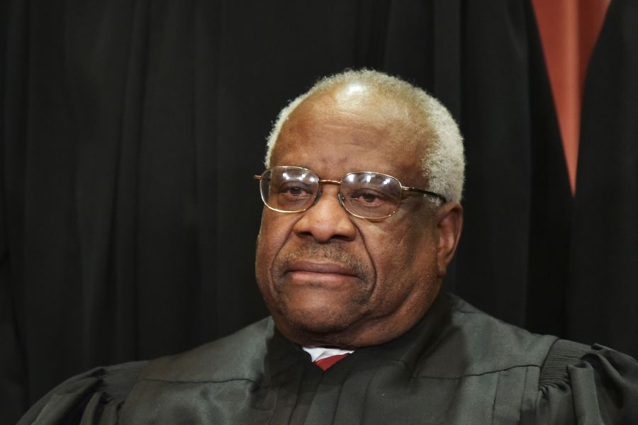 Associate Justice Clarence Thomas poses for the official group photo at the U.S. Supreme Court on November 30, 2018. (Credit: MANDEL NGAN/AFP/Getty Images)