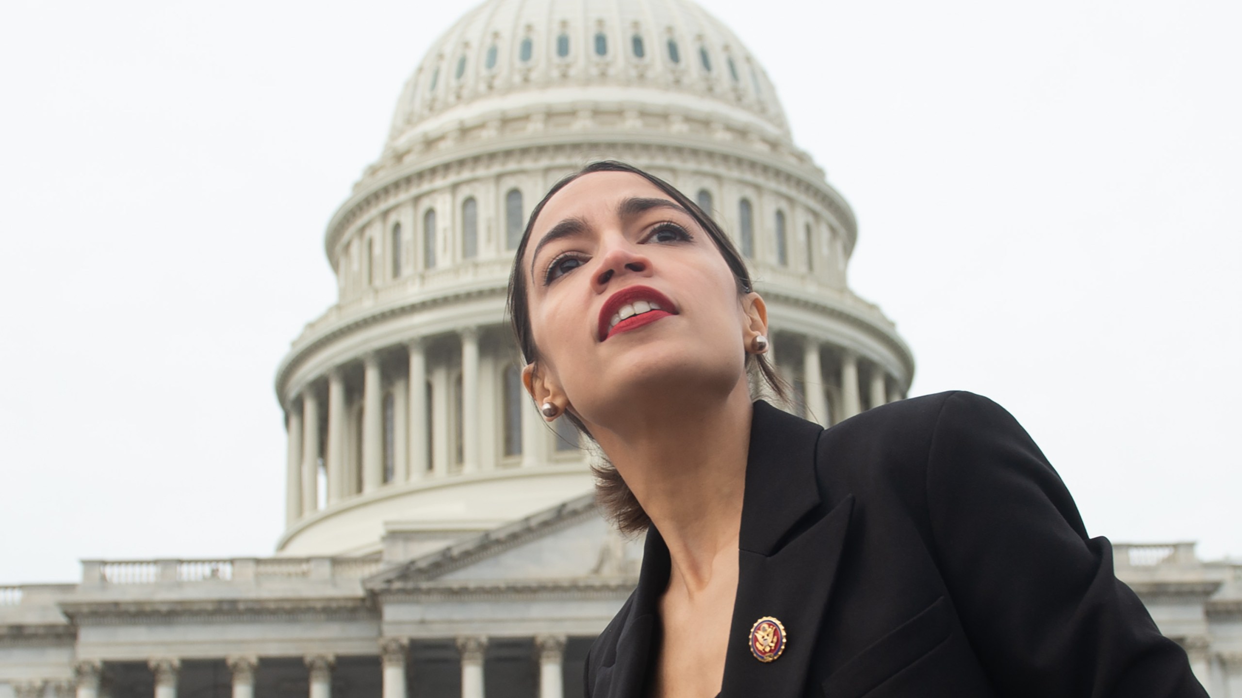 Representative Alexandria Ocasio-Cortez, Democrat of New York, leaves a photo opportunity with the female Democratic members of the 116th U.S. House of Representatives outside the U.S. Capitol on Jan. 4, 2019. (Credit: Saul Loeb/AFP/Getty Images)