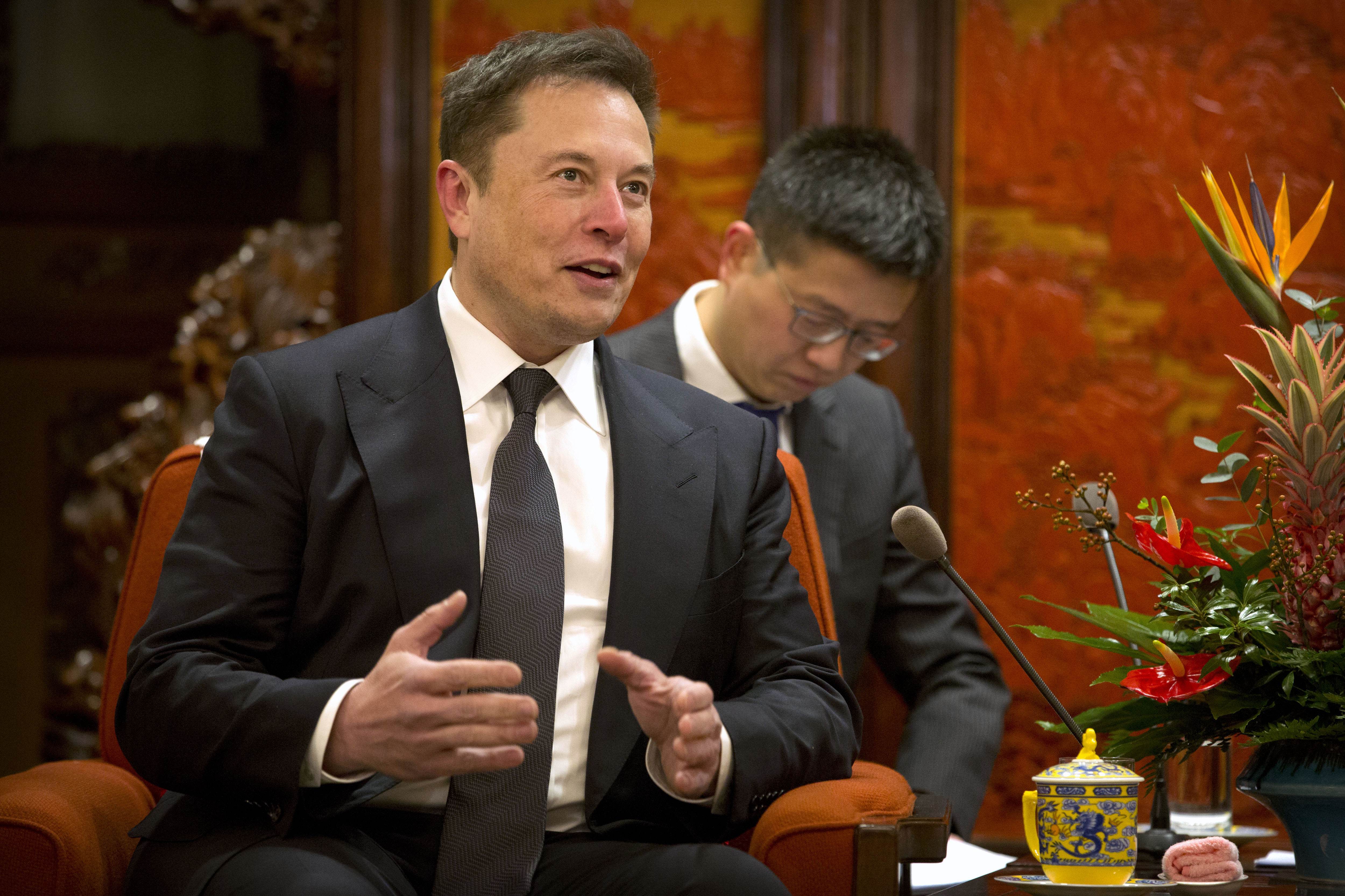 Tesla CEO Elon Musk speaks during a meeting with Chinese Premier Li Keqiang (not pictured) at the Zhongnanhai leadership compound in Beijing on Jan. 9, 2019. (Credit: Mark Schiefelbein / AFP / Getty Images)