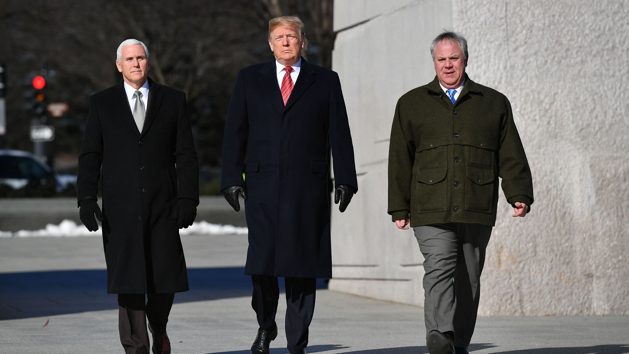 Donald Trump, Vice President Mike Pence (left) and acting Interior Secretary David Bernhardt (right) visit the Martin Luther King Jr. Memorial in Washington, D.C. on Jan. 21, 2019. (Credit: Mandel Ngan/AFP/Getty Images)