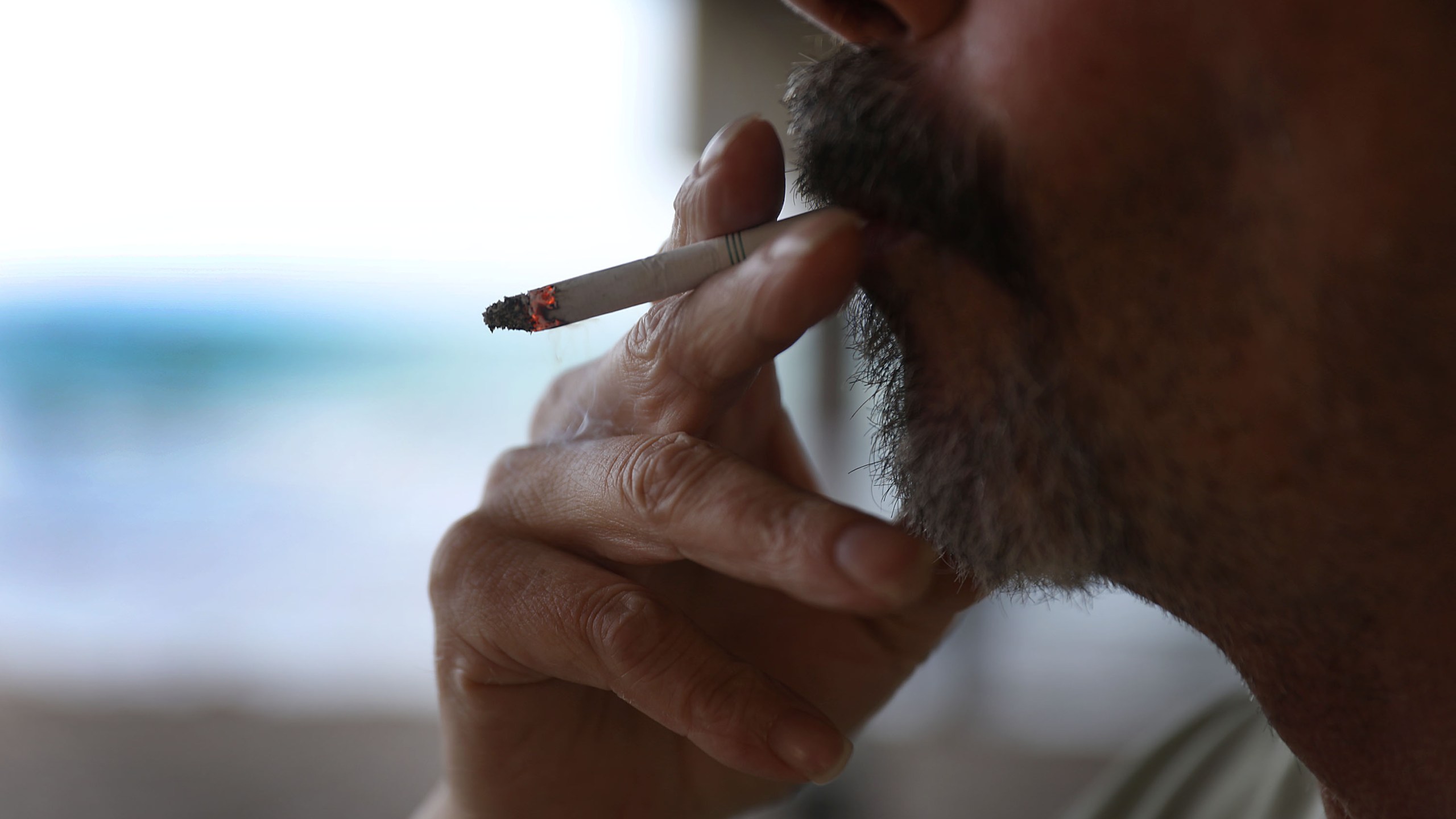 A man smokes a cigarette at Dania Beach, Florida in this Jan. 3, 2019 file photo. (Joe Raedle/Getty Images)