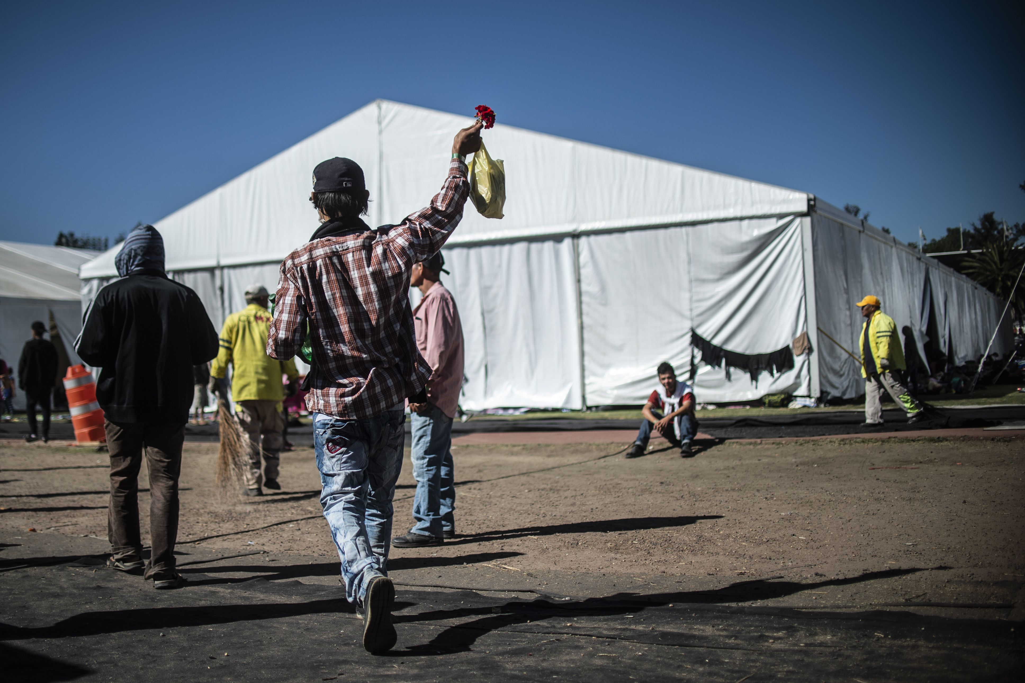 Central American migrants, mostly Hondurans, take part in a caravan heading towards the U.S., staying in a shelter set up at the Sports City in Mexico City on Jan. 30, 2019.(Credit: PEDRO PARDO/AFP/Getty Images)