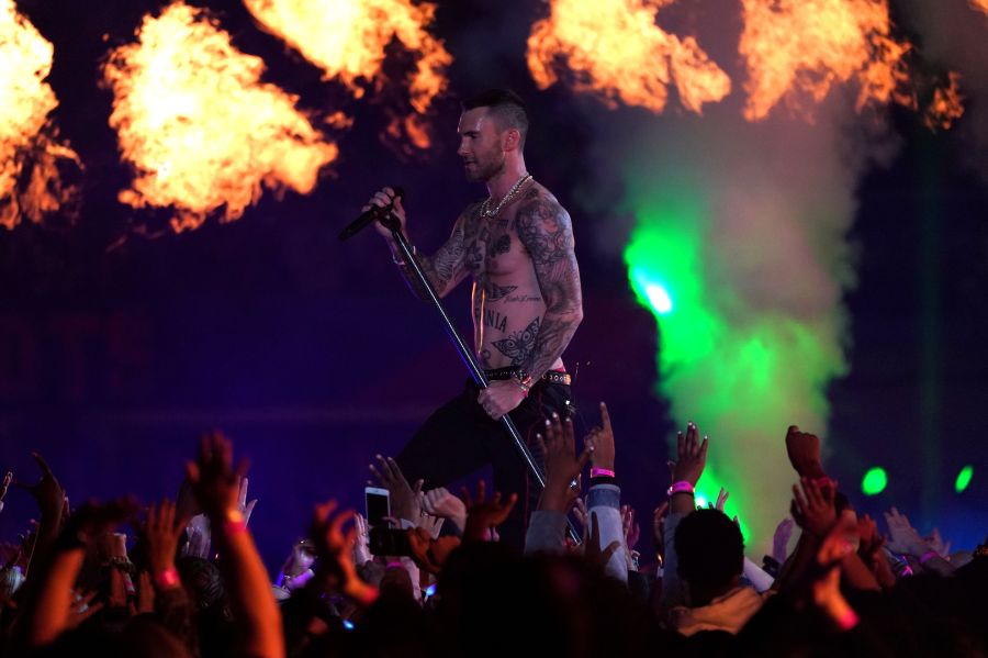 Lead vocalist of Maroon 5 Adam Levine performs during the halftime show of Super Bowl LIII between the New England Patriots and the Los Angeles Rams at Mercedes-Benz Stadium in Atlanta, Georgia, on February 3, 2019. (Credit: TIMOTHY A. CLARY/AFP/Getty Images)