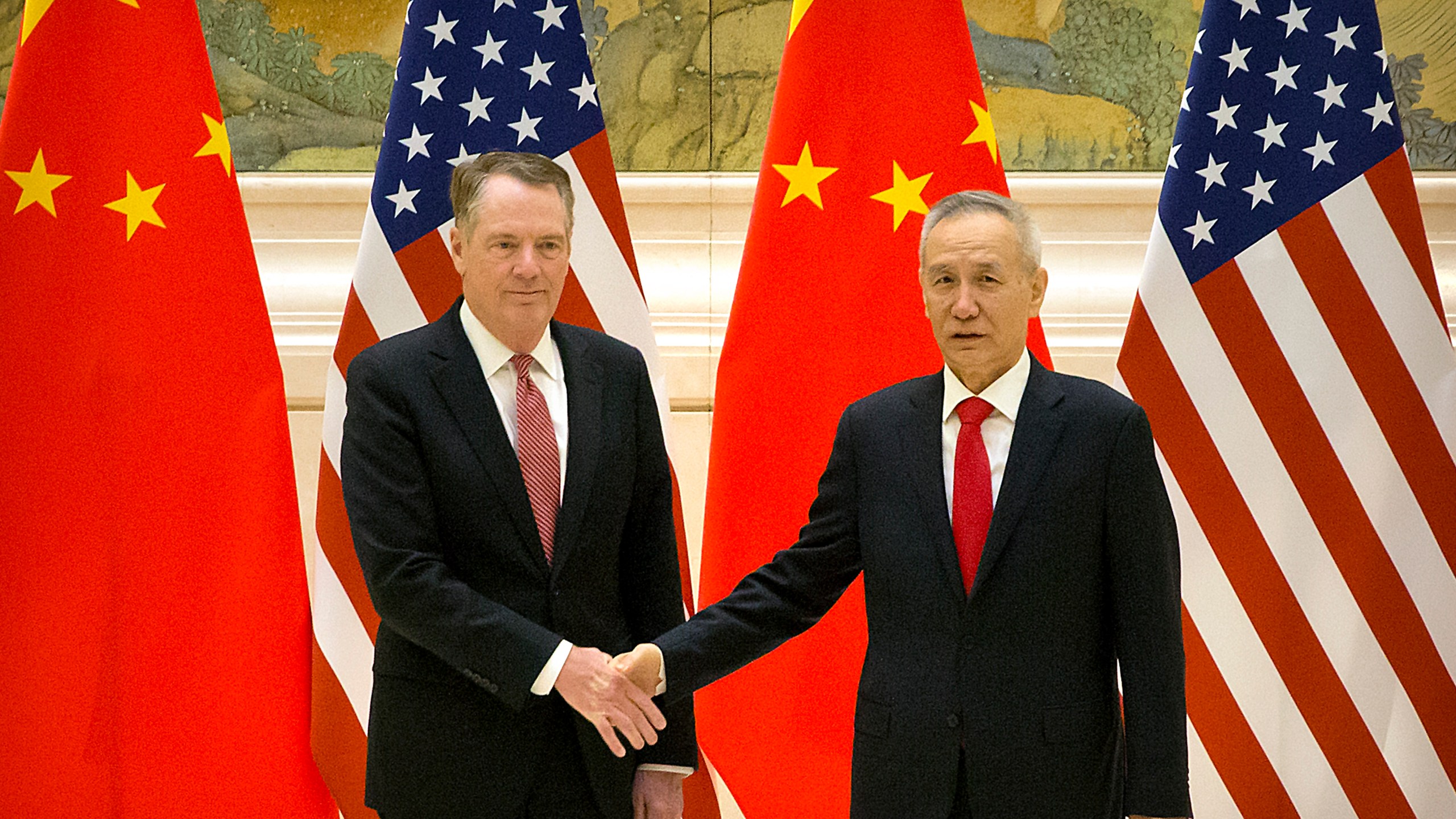 U.S. Trade Representative Robert Lighthizer and Chinese lead trade negotiator Liu He shake hands before the opening session of trade negotiations in Beijing on Feb. 14, 2019. (Credit: Mark Schiefelbein/AFP/Getty Images)