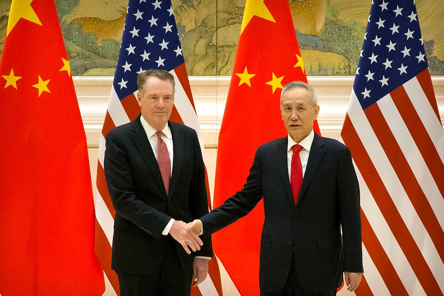 U.S. Trade Representative Robert Lighthizer and Chinese lead trade negotiator Liu He shake hands before the opening session of trade negotiations in Beijing on Feb. 14, 2019. (Credit: Mark Schiefelbein/AFP/Getty Images)