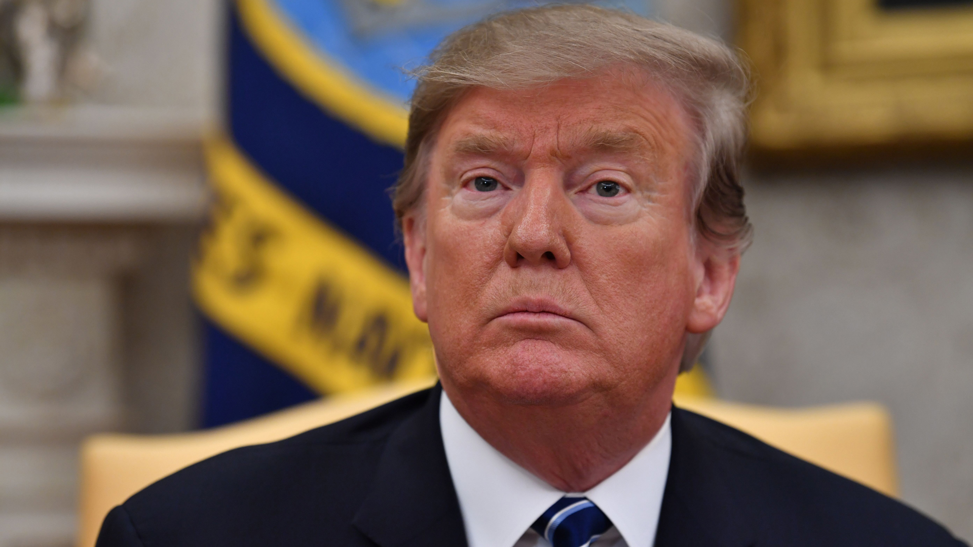 Donald Trump listens during a meeting in the Oval Office at the White House in Washington D.C., on Feb. 20, 2019. (Credit: Nicholas Kamm/AFP/Getty Images)