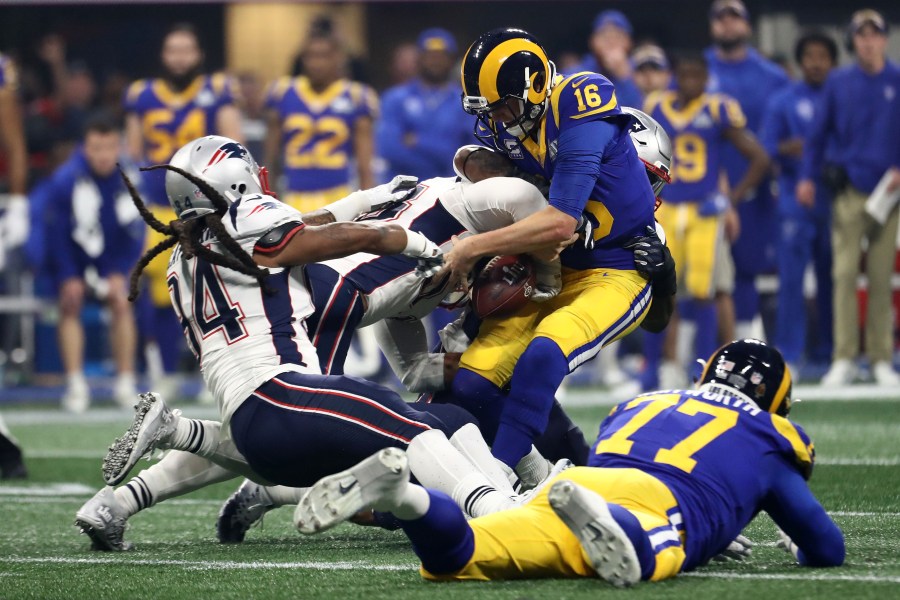 Jared Goff of the Los Angeles Rams, is sacked by Kyle Van Noy and Dont'a Hightower of the New England Patriots in the second half during Super Bowl LIII at Mercedes-Benz Stadium in Atlanta on Feb. 3, 2019. (Credit: Al Bello / Getty Images)