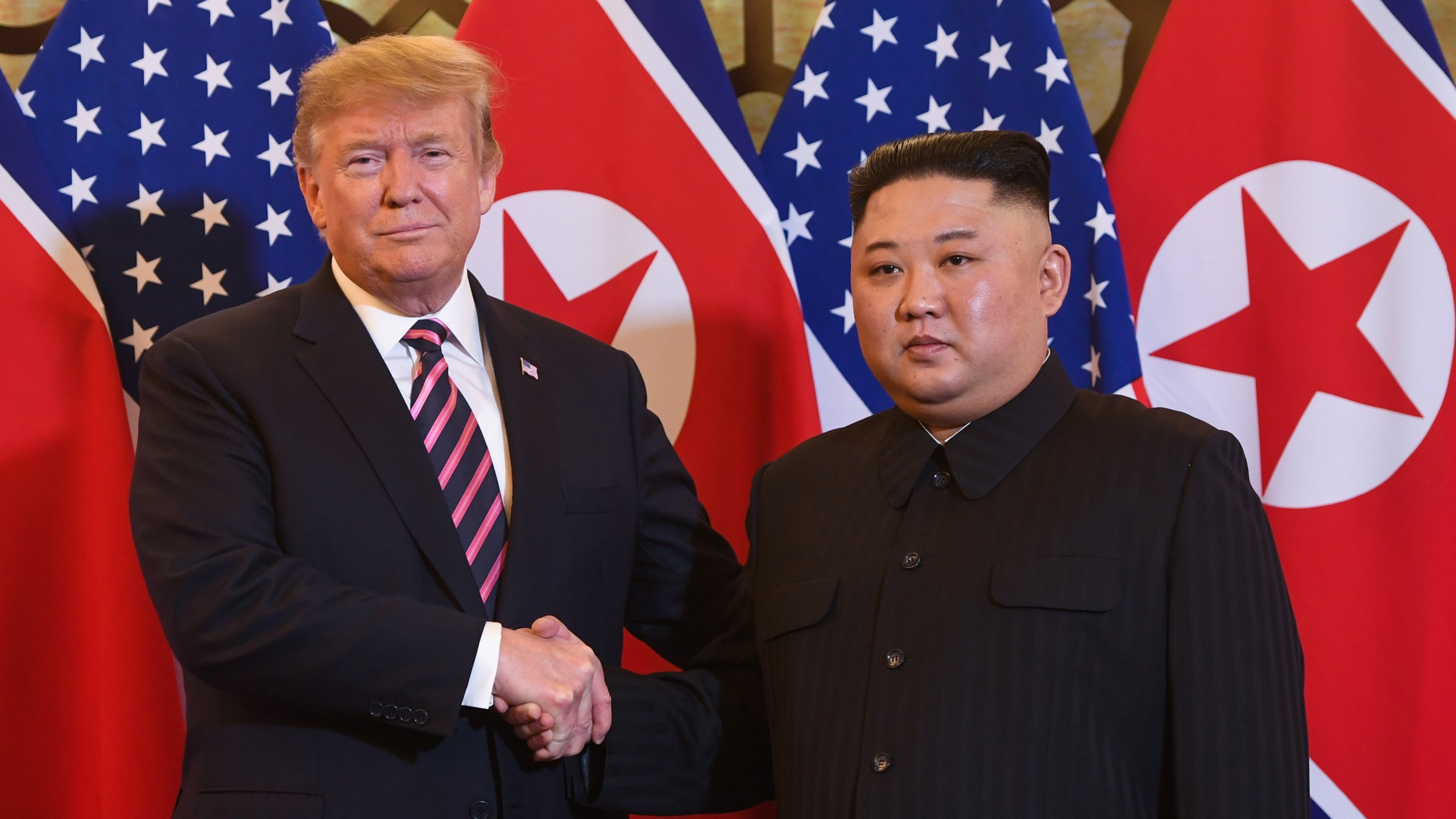 U.S. President Donald Trump shakes hands with North Korea's leader Kim Jong Un before a meeting at the Sofitel Legend Metropole hotel in Hanoi on Feb. 27, 2019. (Credit: SAUL LOEB/AFP/Getty Images)