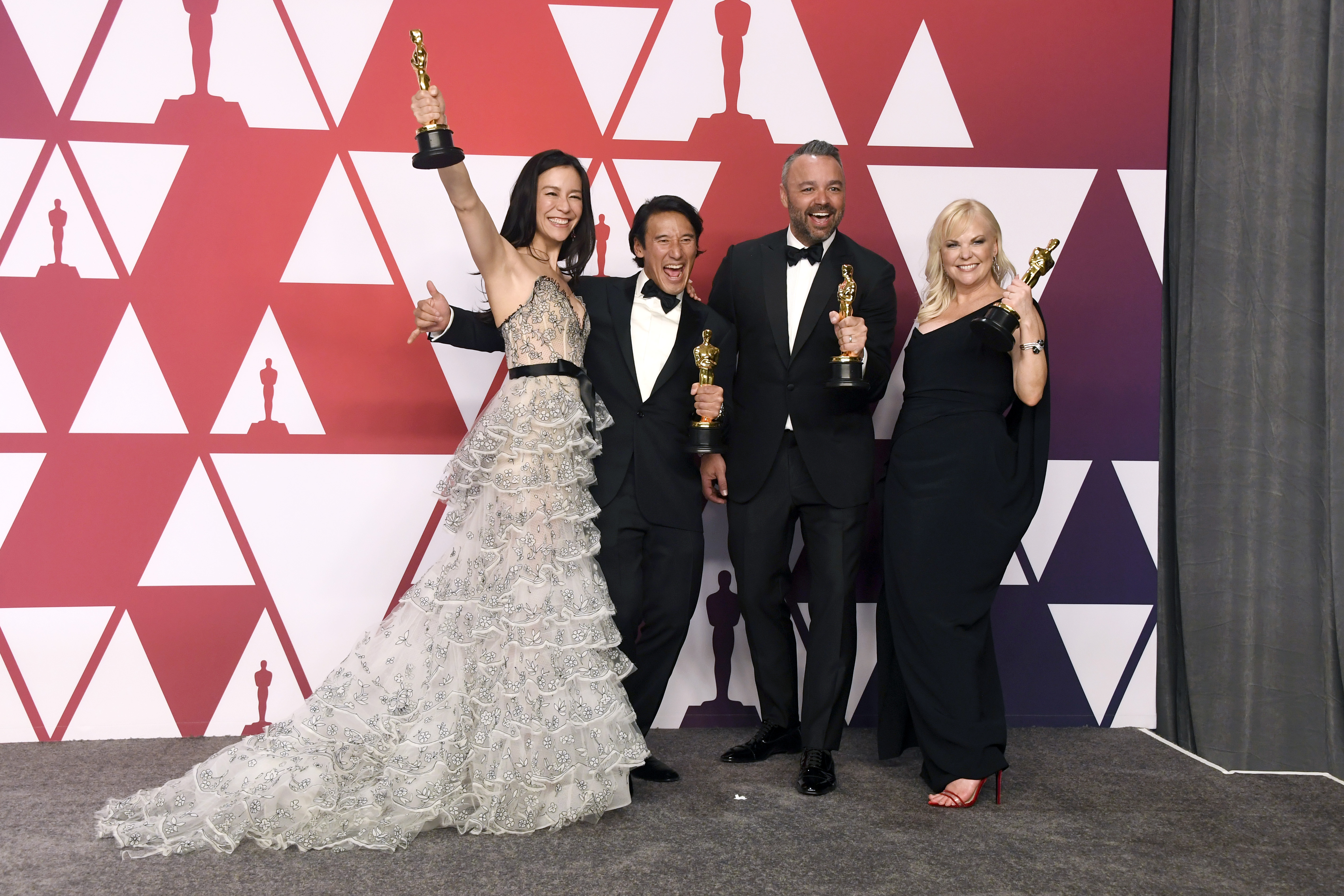 (L-R) Elizabeth Chai Vasarhelyi, Jimmy Chin, Evan Hayes, and Shannon Dill, winners of Best Documentary Feature for 'Free Solo,' pose in the press room during the 91st Annual Academy Awards at Hollywood and Highland on February 24, 2019 in Hollywood, California. (Credit: Frazer Harrison/Getty Images)