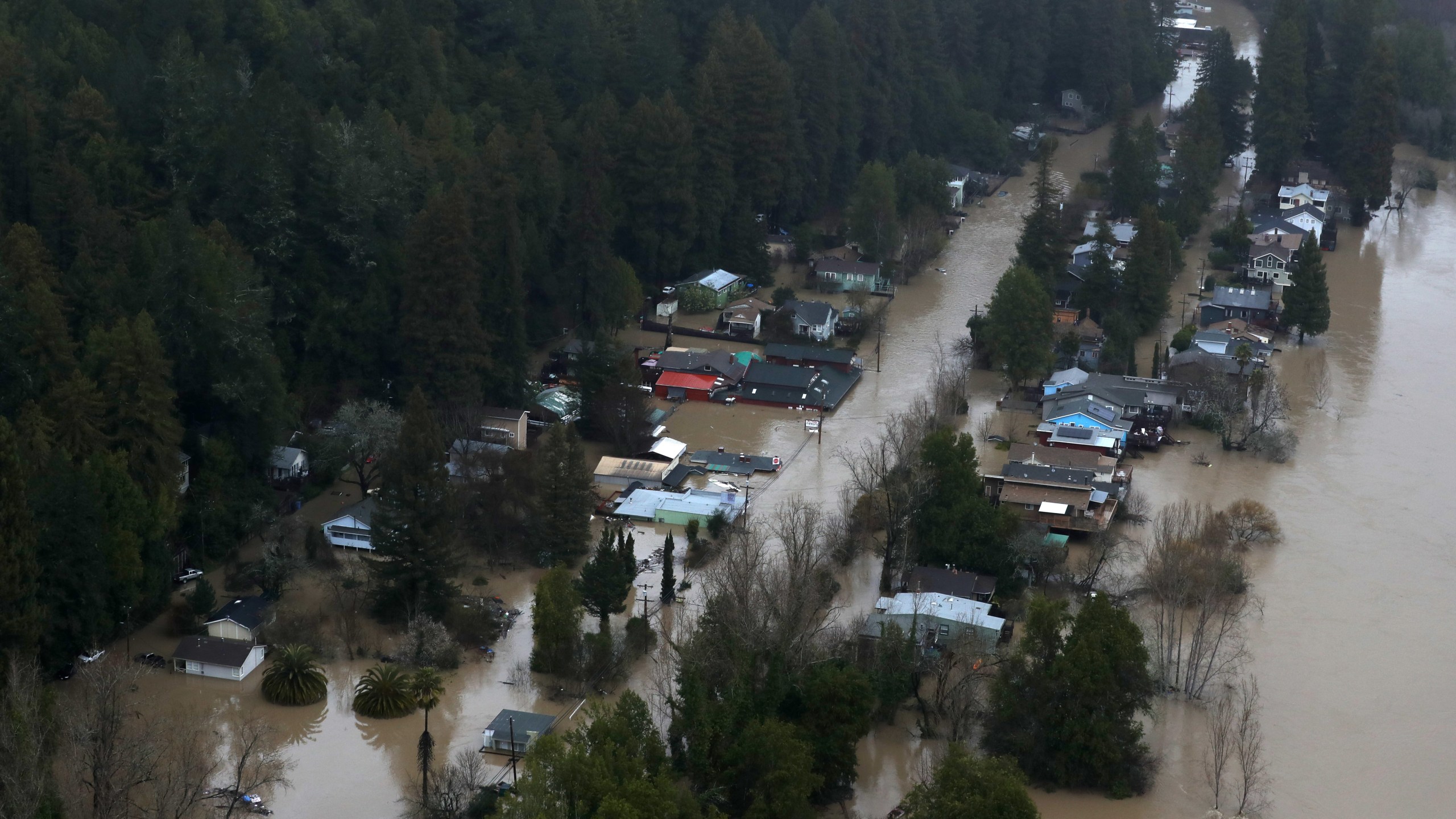 Homes sit under water in a flooded neighborhood in Guerneville, California, on Feb. 27, 2019. (Credit: Justin Sullivan / Getty Images)