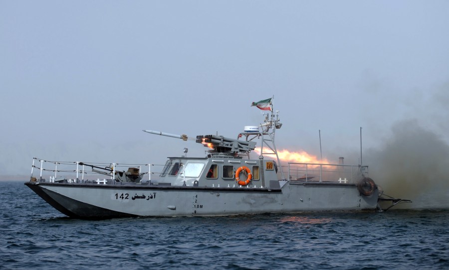 An Iranian war-boat fires a missile during navy exercises in the Strait of Hormuz in southern Iran on Dec. 30, 2011. (Credit: Ali Mohammadi/AFP/Getty Images)