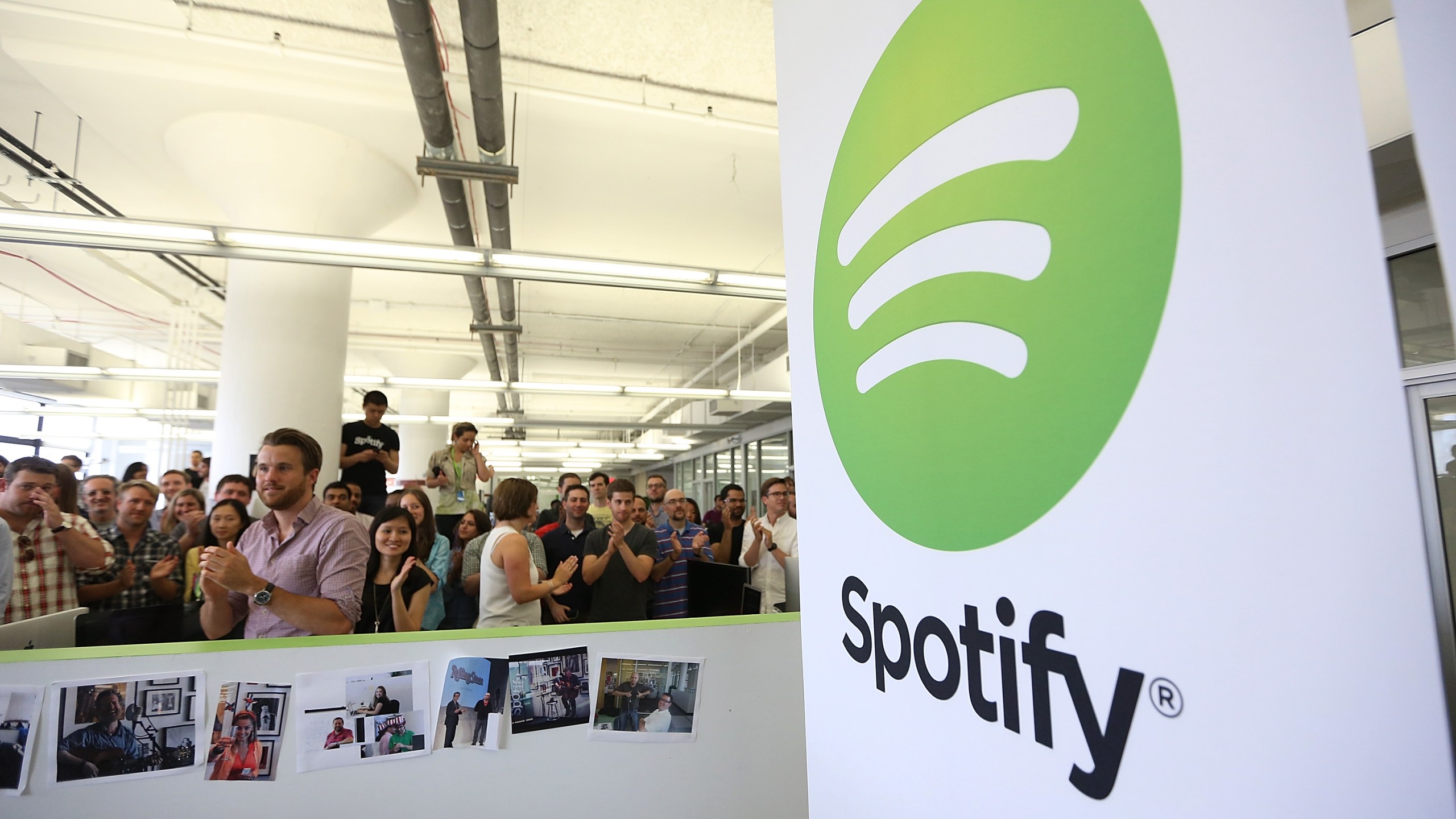 People gather in Spotify offices following a press conference on June 27, 2013 in New York City. (Credit: Mario Tama/Getty Images)