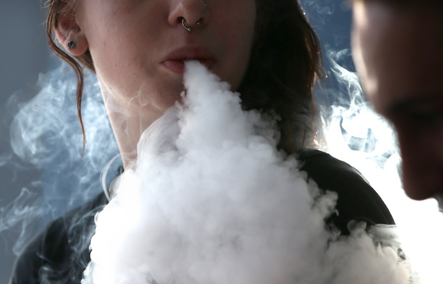 Rhiannon Griffith-Bowman smokes an e-cigarette at Digital Ciggz on Jan. 28, 2015, in San Rafael, Calif. (Credit: Justin Sullivan/Getty Images)