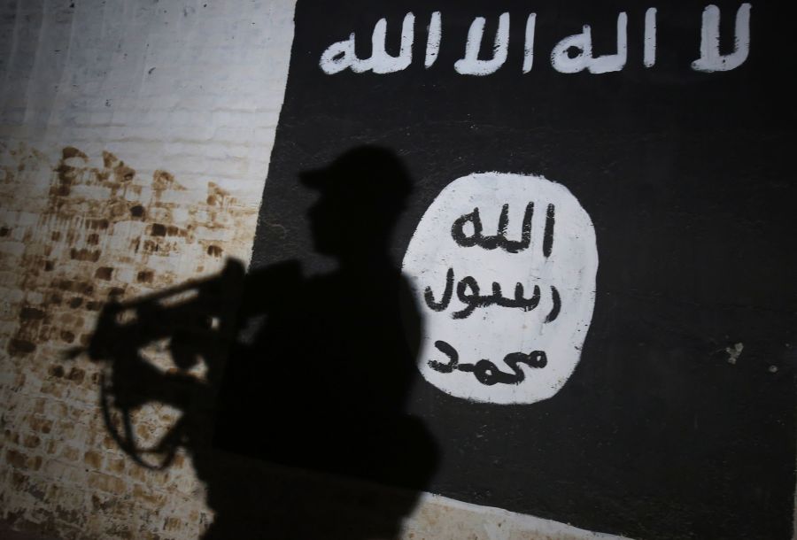 A mural bearing the logo of the Islamic State (IS) group on March 1, 2017, in the village of Albu Sayf, on the southern outskirts of Mosul. (Credit: AHMAD AL-RUBAYE/AFP/Getty Images)