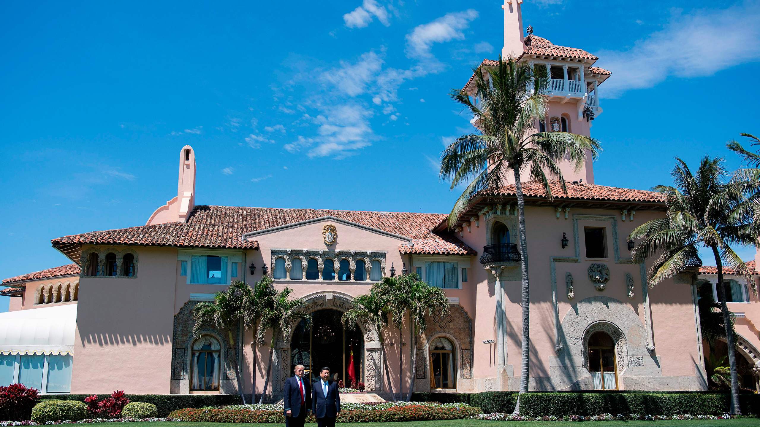 President Donald Trump, left, and Chinese President Xi Jinping pose together at Trump's Mar-a-Lago estate in West Palm Beach, Florida, on April 7, 2017. (Credit: Jim Watson / AFP / Getty Images)