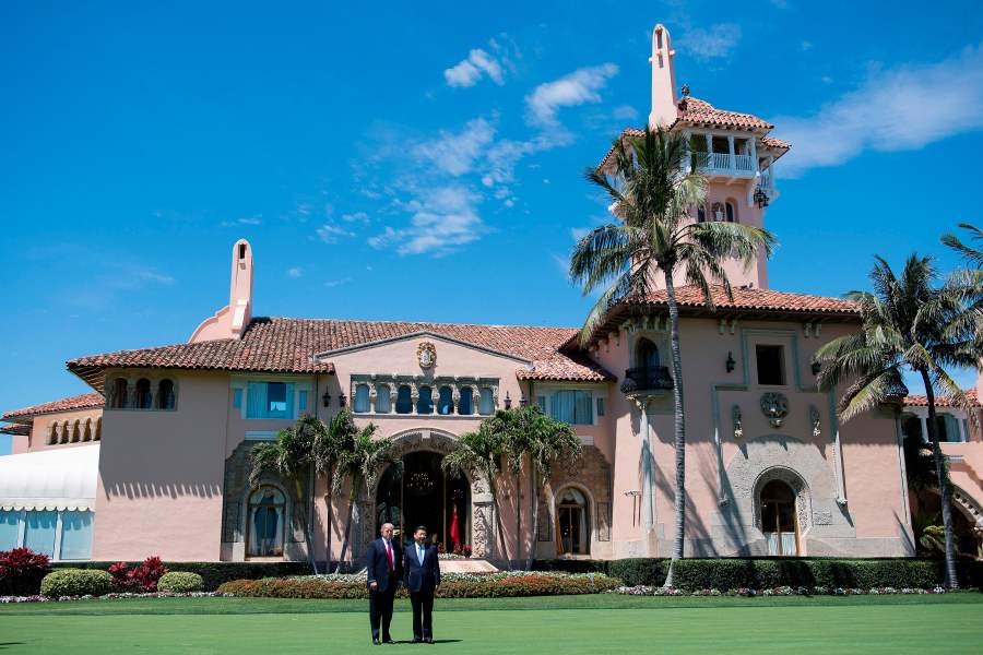 President Donald Trump, left, and Chinese President Xi Jinping pose together at Trump's Mar-a-Lago estate in West Palm Beach, Florida, on April 7, 2017. (Credit: Jim Watson / AFP / Getty Images)