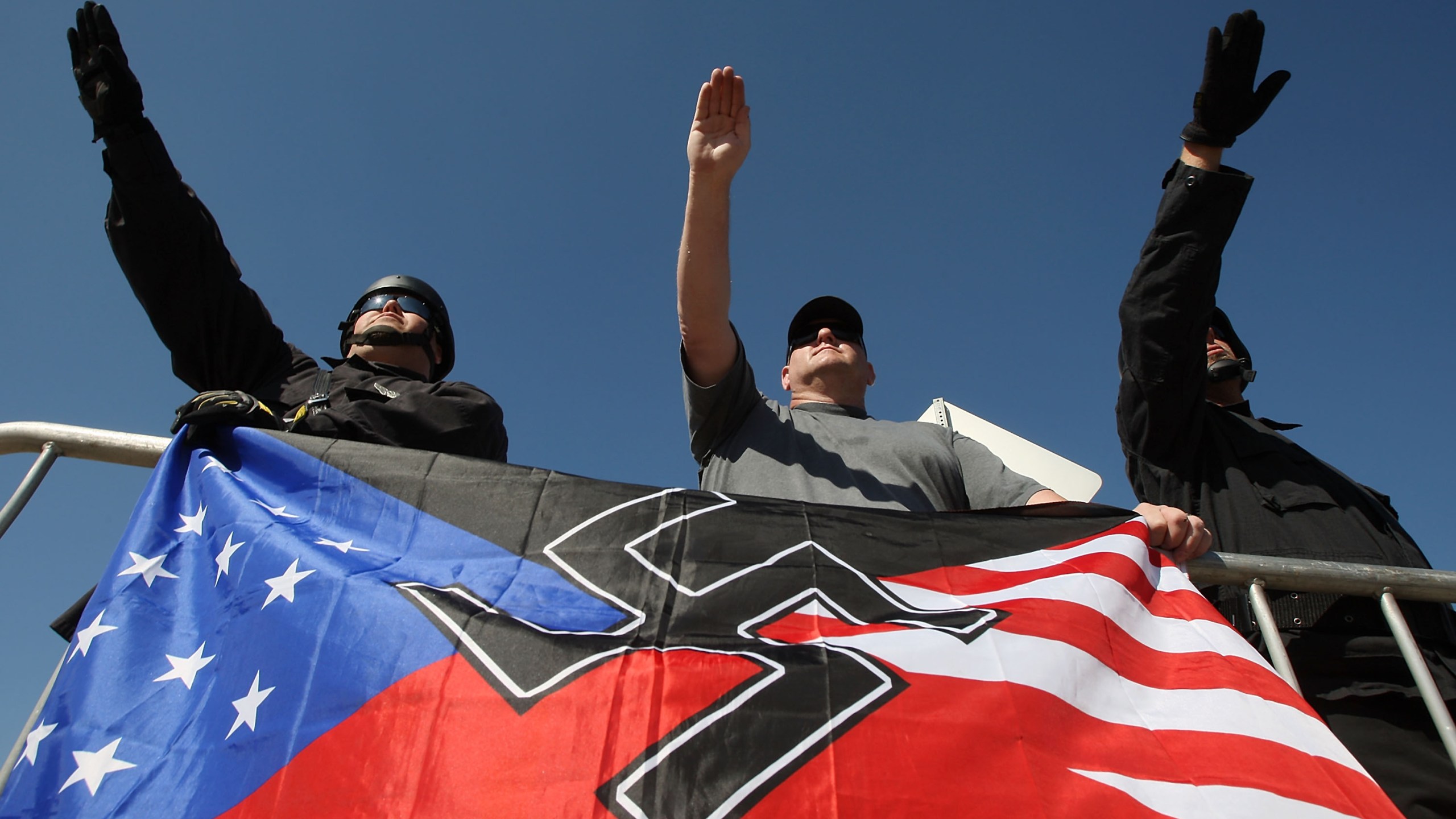 Members of the National Socialist Movement, salute during a rally on Oct. 24, 2009, in Riverside. (Credit: David McNew/Getty Images)