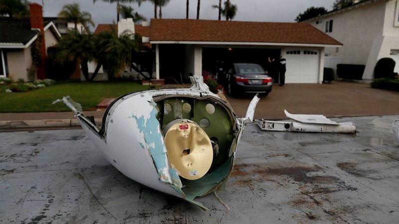 Pieces of a Cessna airplane that broke apart in midair lie in a Yorba Linda neighborhood on Feb. 3, 2019. (Credit: Allen J. Schaben / Los Angeles Times)