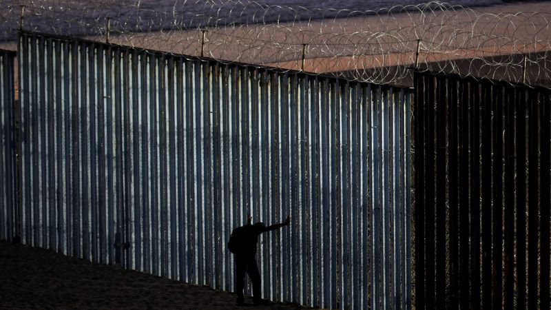 The border wall is fortified with concertina wire at Playas Tijuana along the U.S.-Mexico border in Tijuana. (Credit: Gary Coronado / Los Angeles Times)