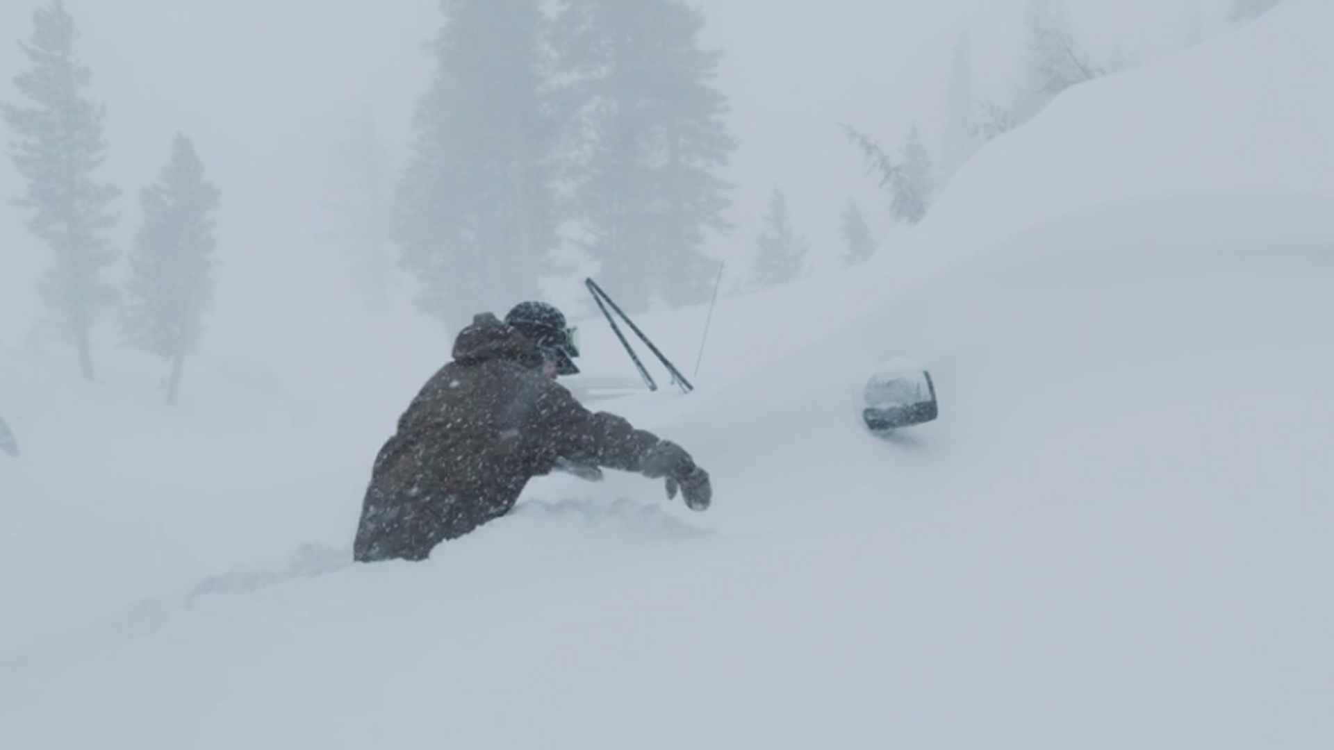 A person tries to walk through waist-high snow in Mammoth earlier this month. (Credit: MMSA)