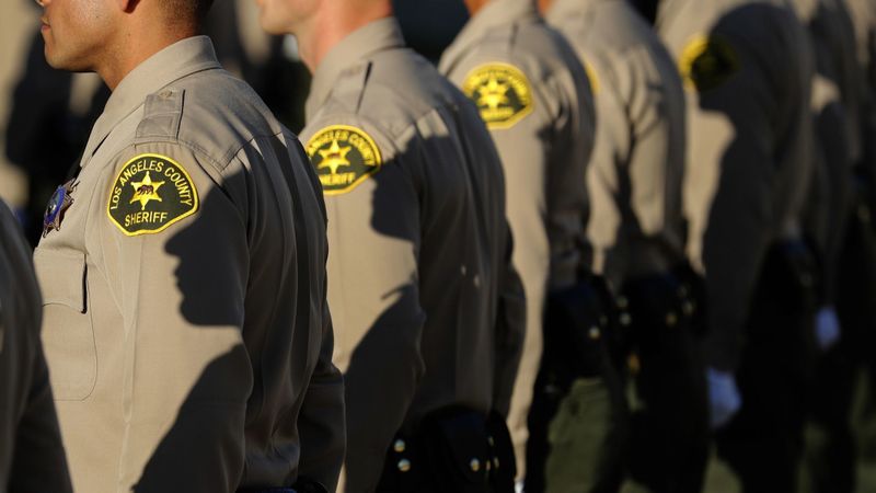 Los Angeles County sheriff’s deputies stand at attention during a graduation ceremony in East Los Angeles on Oct. 27, 2017. (Mel Melcon / Los Angeles Times)