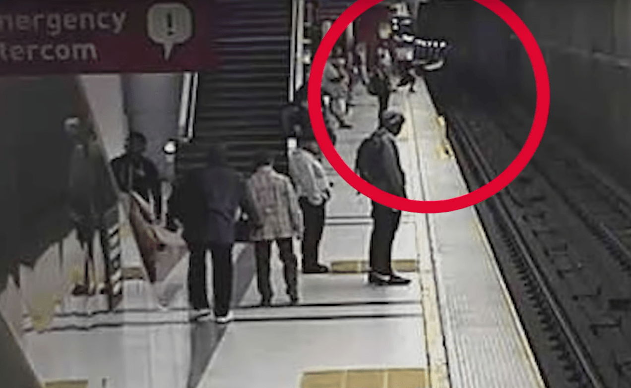 A still from a video released by LAPD on Feb. 4, 2019 shows two people apparently falling into the train tracks at Metro's Pershing Square Station.