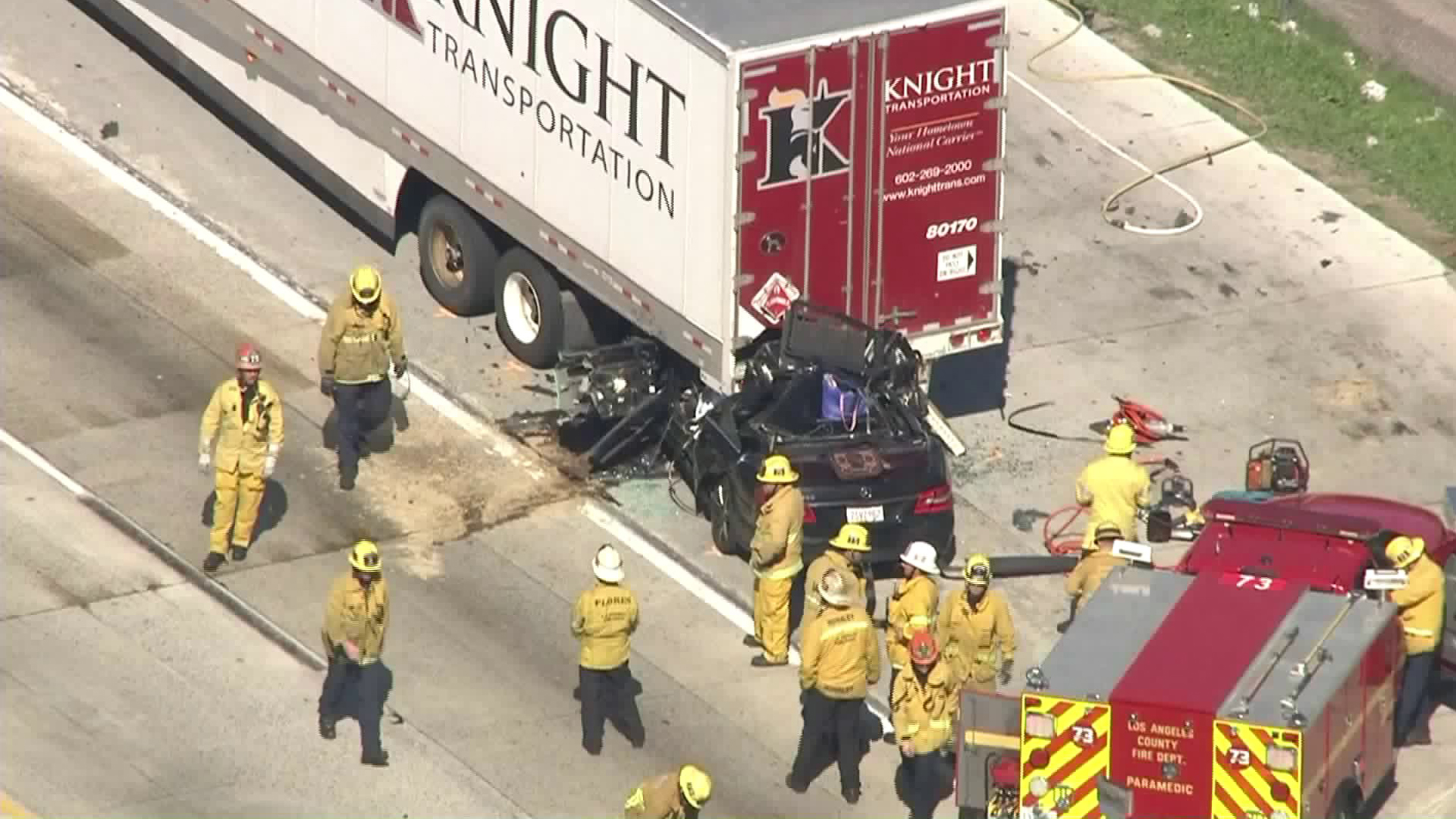 A vehicle ended up stuck under a semi truck after a crash along the 5 Freeway near Sylmar on Feb. 19, 2019. (Credit: KTLA)