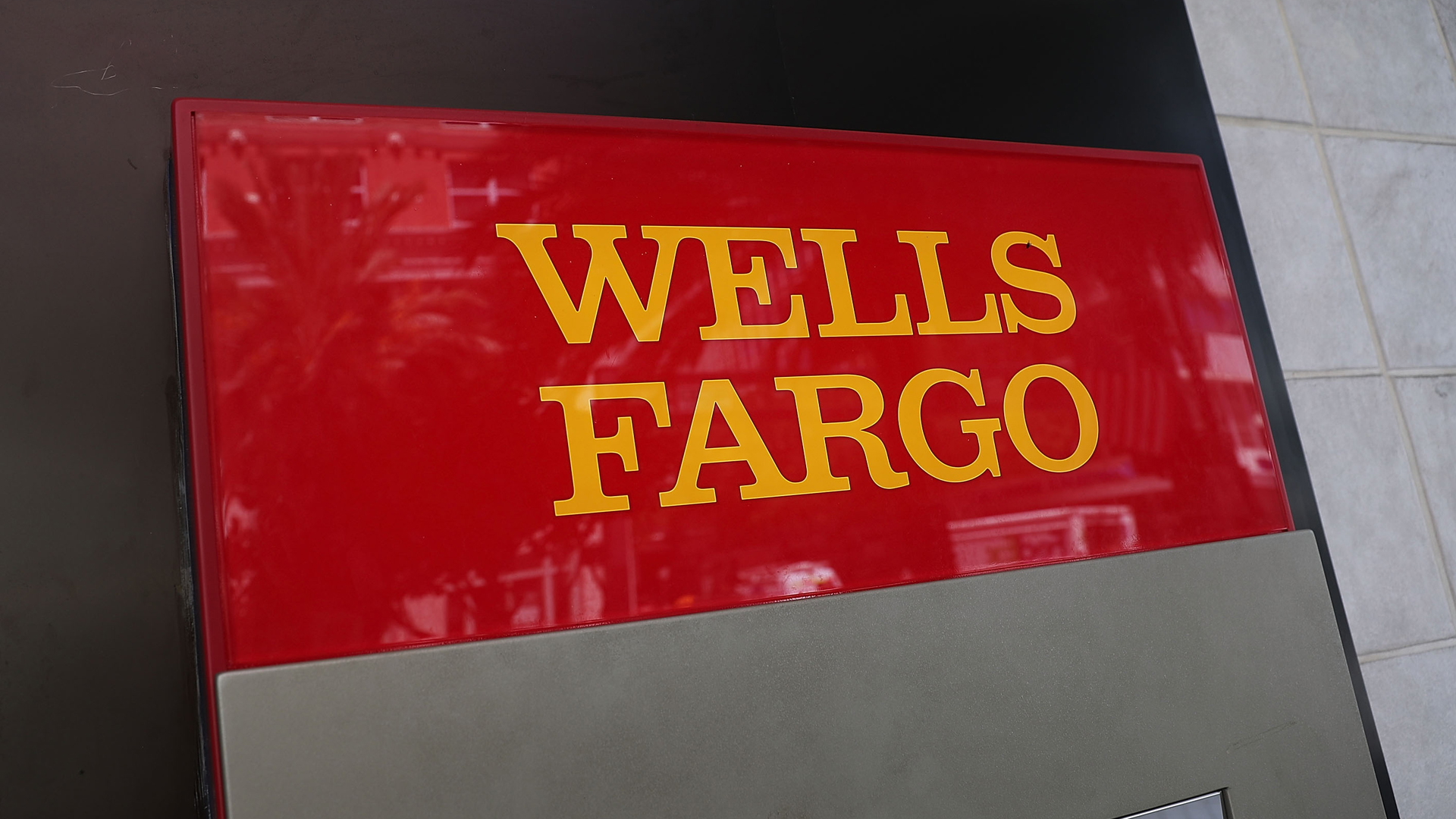 A sign is seen on a Wells Fargo ATM at one of their bank branches on September 9, 2016 in Miami. (Credit: Joe Raedle/Getty Images)