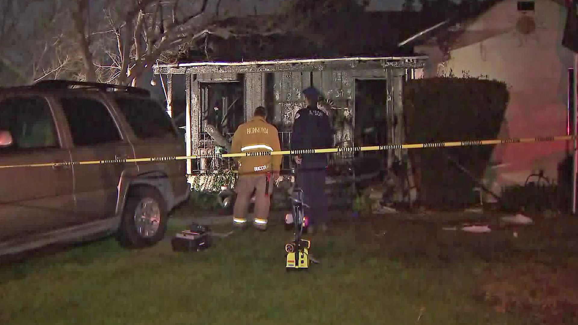 Investigators are seen at a house fire in Monrovia on March 7, 2019. (Credit: KTLA)