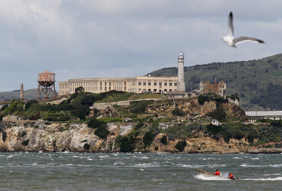 A boat passes in front of Alcatraz Island on April 7, 2011 in San Francisco. (Credit: Justin Sullivan/Getty Images)