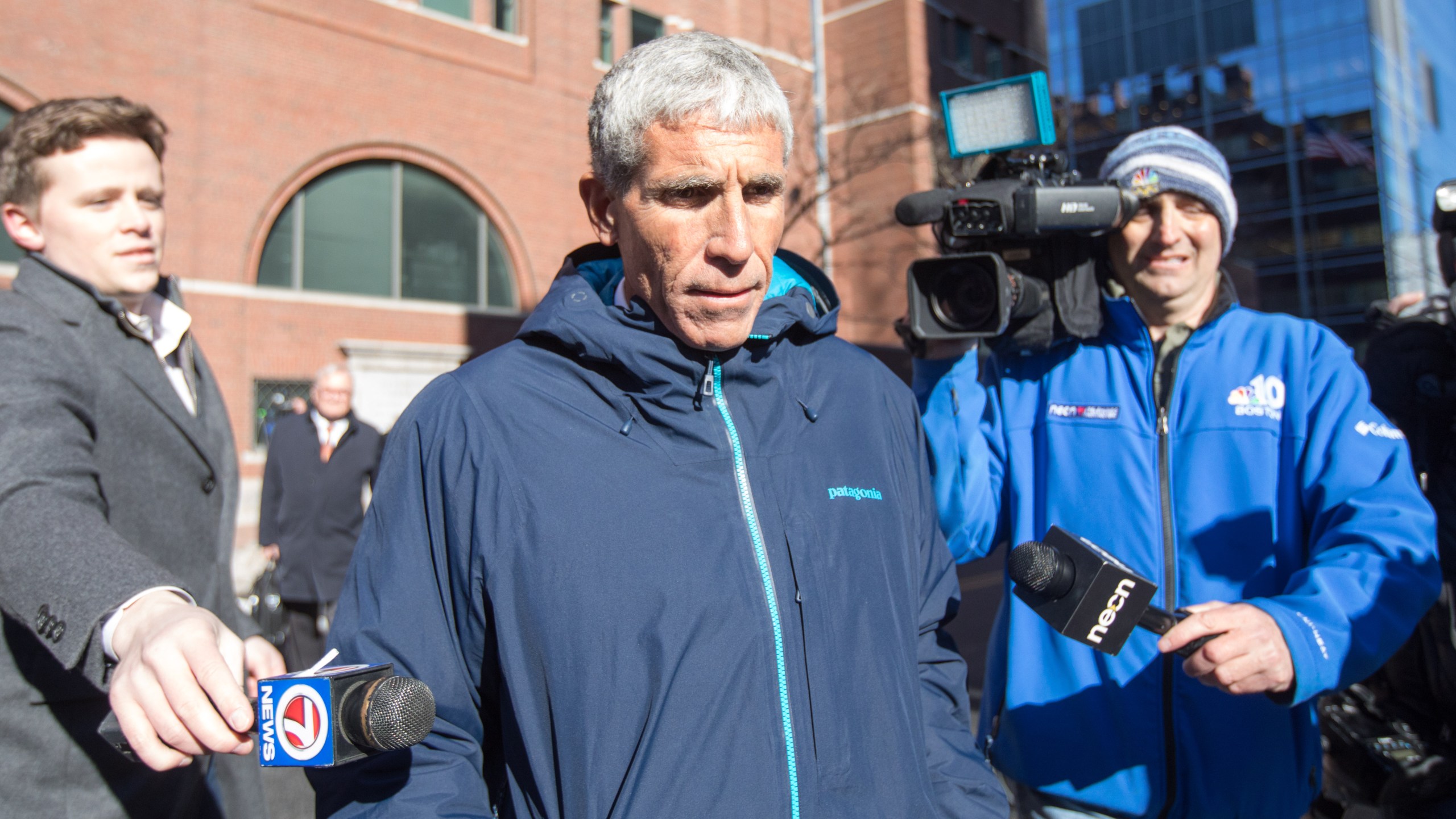 William "Rick" Singer leaves Boston Federal Court after being charged with racketeering conspiracy, money laundering conspiracy, conspiracy to defraud the United States and obstruction of justice on March 12, 2019. (Scott Eisen / Getty Images)