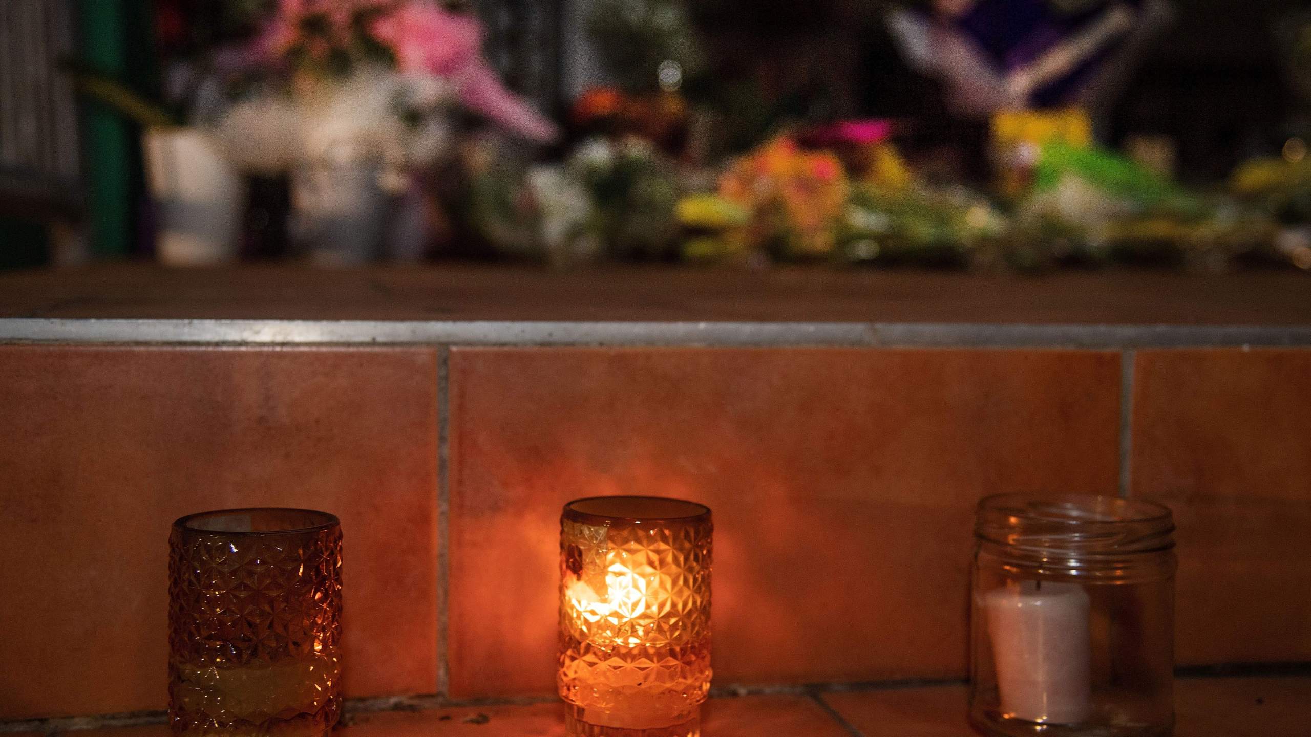 Flowers and candles are placed on the front steps of the Wellington Masjid mosque in Kilbirnie in Wellington on March 15, 2019, after a shooting incident at two mosques in Christchurch. (Credit: MARTY MELVILLE/AFP/Getty Images)