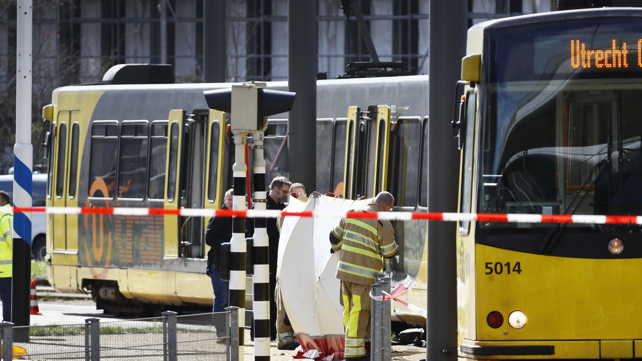 Police forces and emergency services stand at the 24 Oktoberplace in Utrecht, on March 18, 2019 where a shooting took place. (Credit: ROBIN VAN LONKHUIJSEN/AFP/Getty Images)