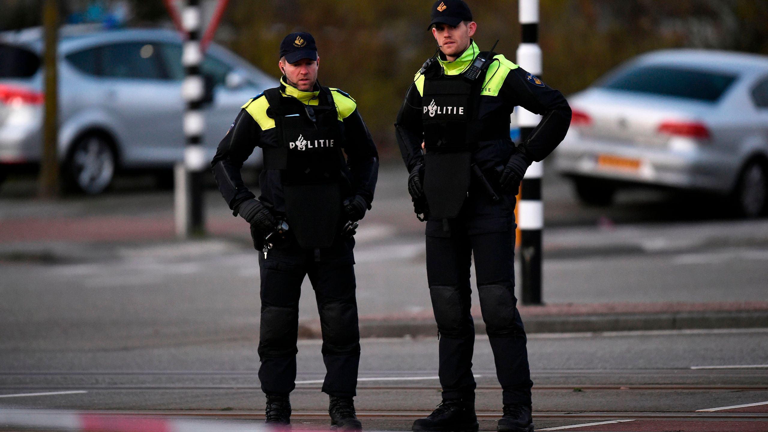 Policemen stand near a tram where a gunman opened fire killing at least three persons and wounding several in what officials said was a possible terrorist incident, on March 18, 2019 in Utrecht. (Credit: JOHN THYS/AFP/Getty Images)