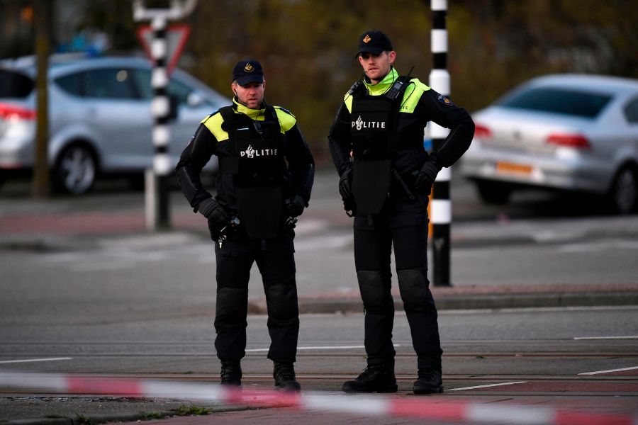 Policemen stand near a tram where a gunman opened fire killing at least three persons and wounding several in what officials said was a possible terrorist incident, on March 18, 2019 in Utrecht. (Credit: JOHN THYS/AFP/Getty Images)